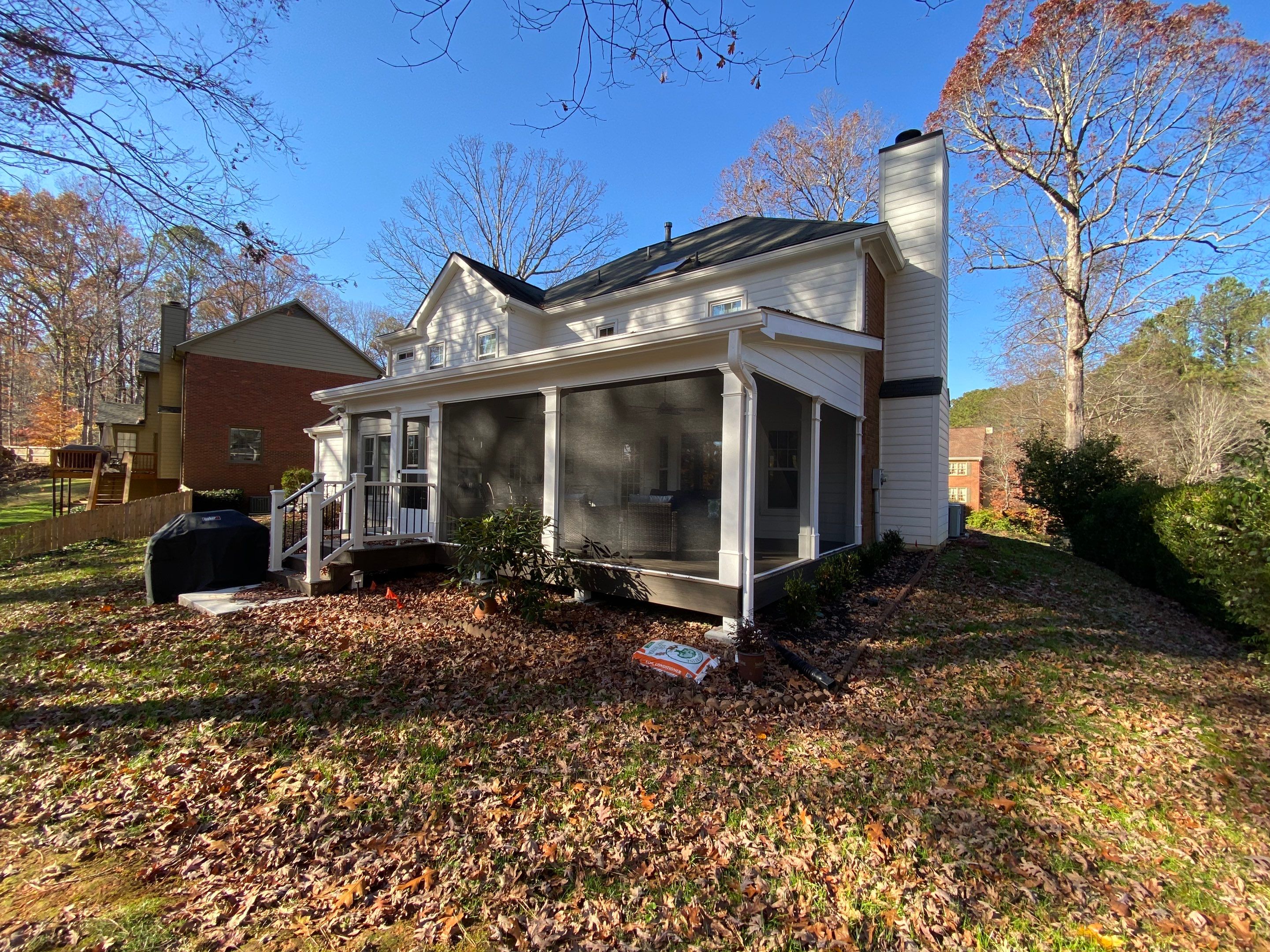 Custom Screened Porch with Beadboard Ceiling and Composite Decking by Swift Home Renovations
