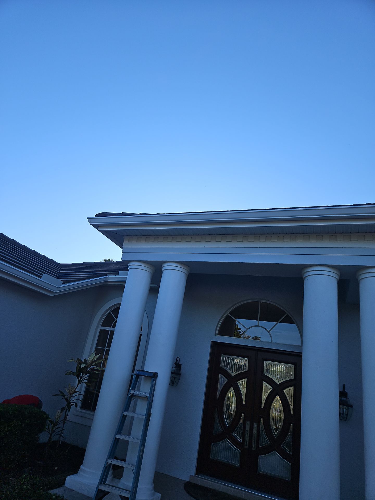 White Down Spouts using downspouts and White Seamless Gutters in Sarasota FL by Gutter Professors