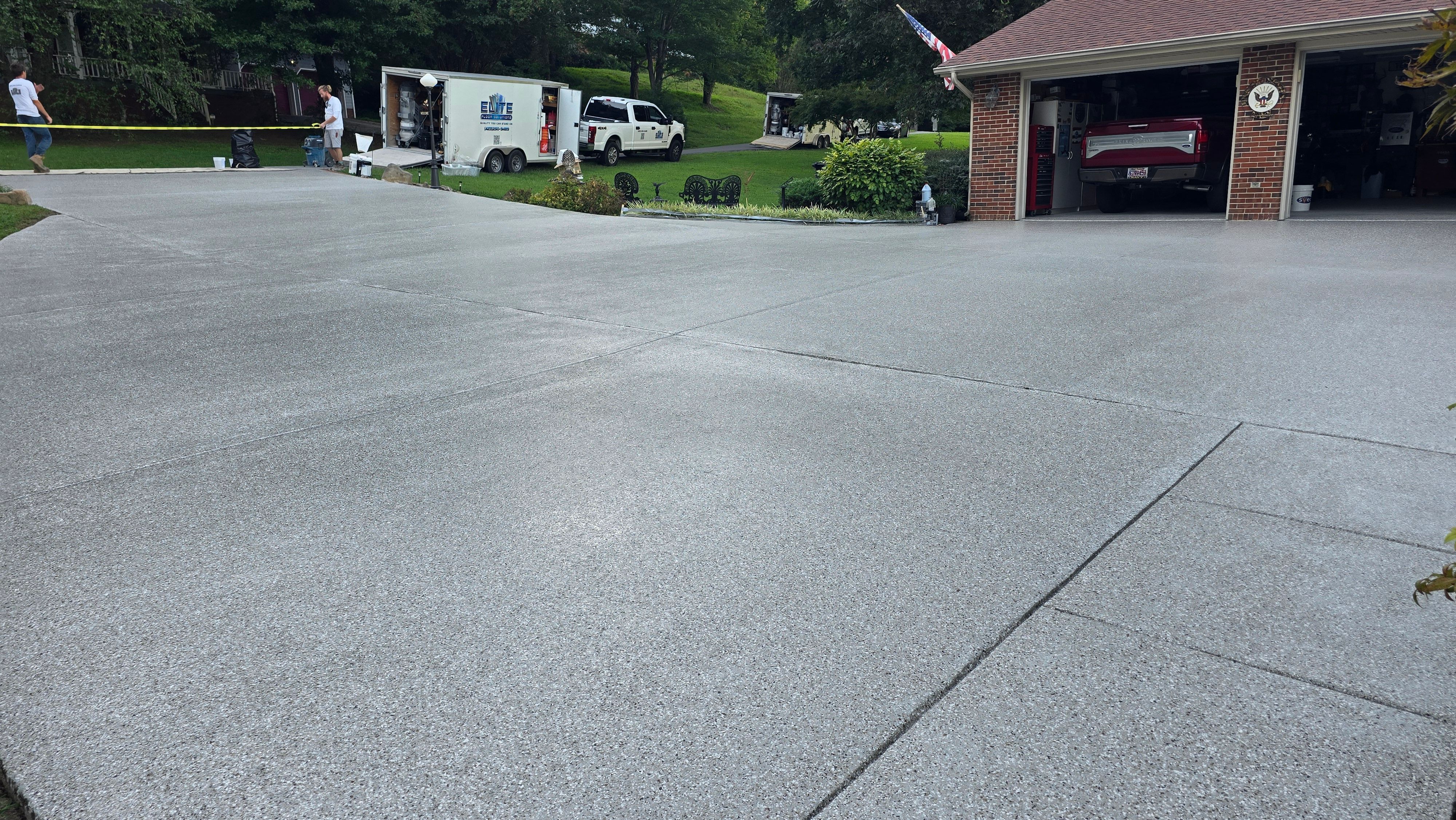 Driveway, Garage, Porch, and Sidewalk using Creekbed by Elite Floor Solutions