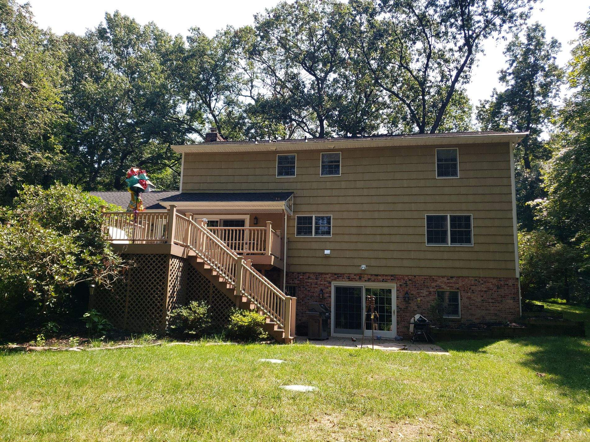 White Board & Batten Siding with Black Trim by Roof Right Inc