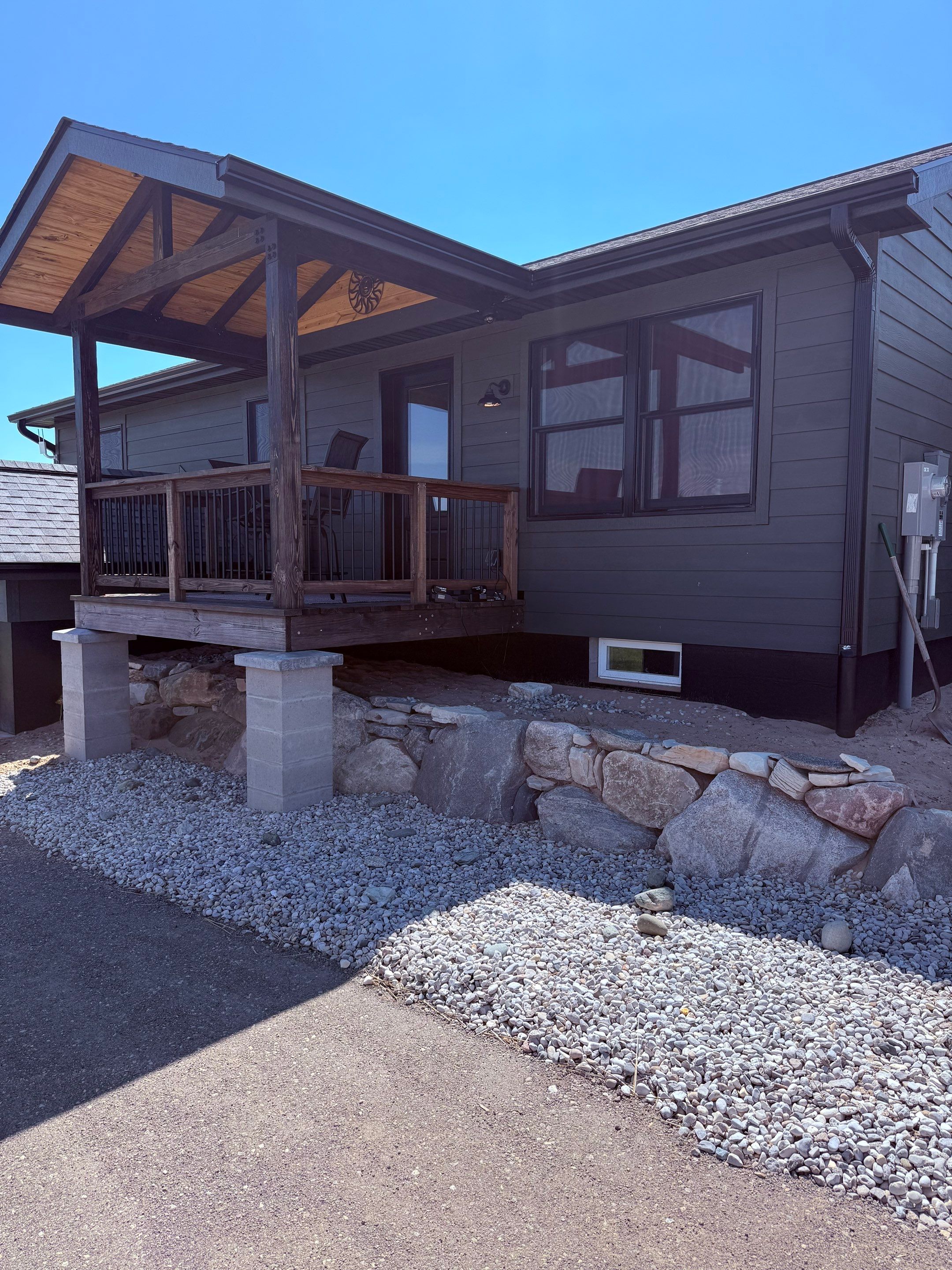Seamless Black Gutter and Downspout Installation in Bear Lake by Rainbow Seamless Systems