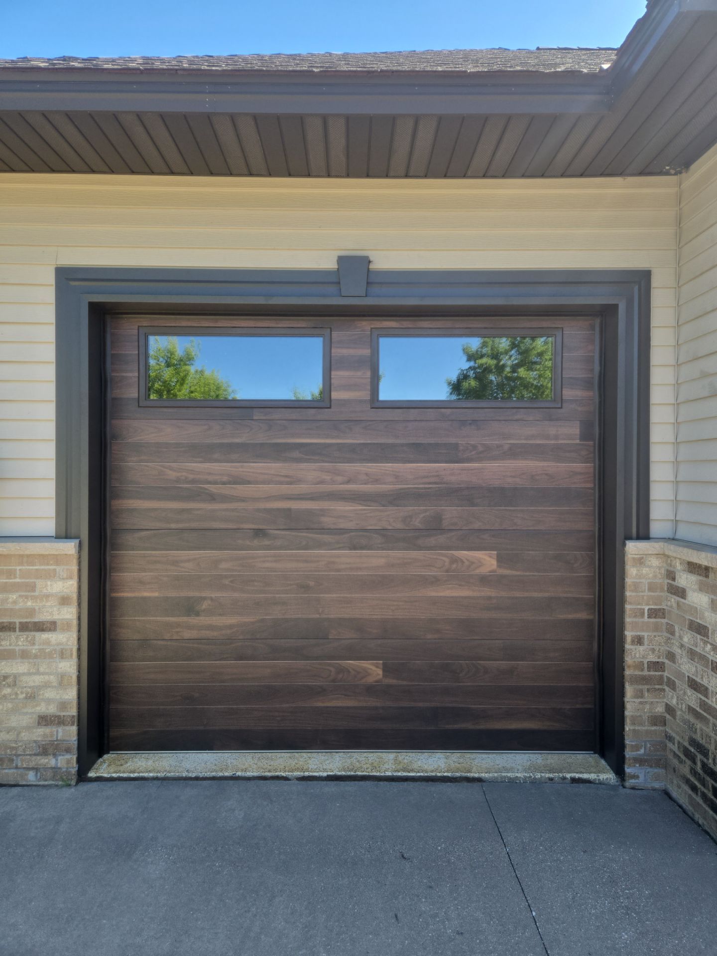 Bronze Garage Door Wrap with Two-Piece Diamond Bend by Next Level Seamless Gutters / Exteriors Inc.