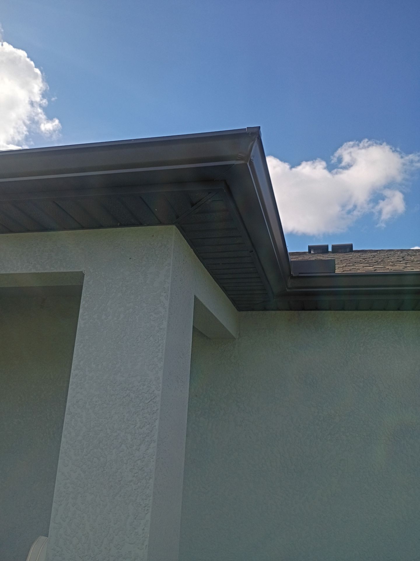 Dark Bronze Seamless Gutters using 6 Inch Seamless Gutters in Cape Coral FL by Gutter Professors