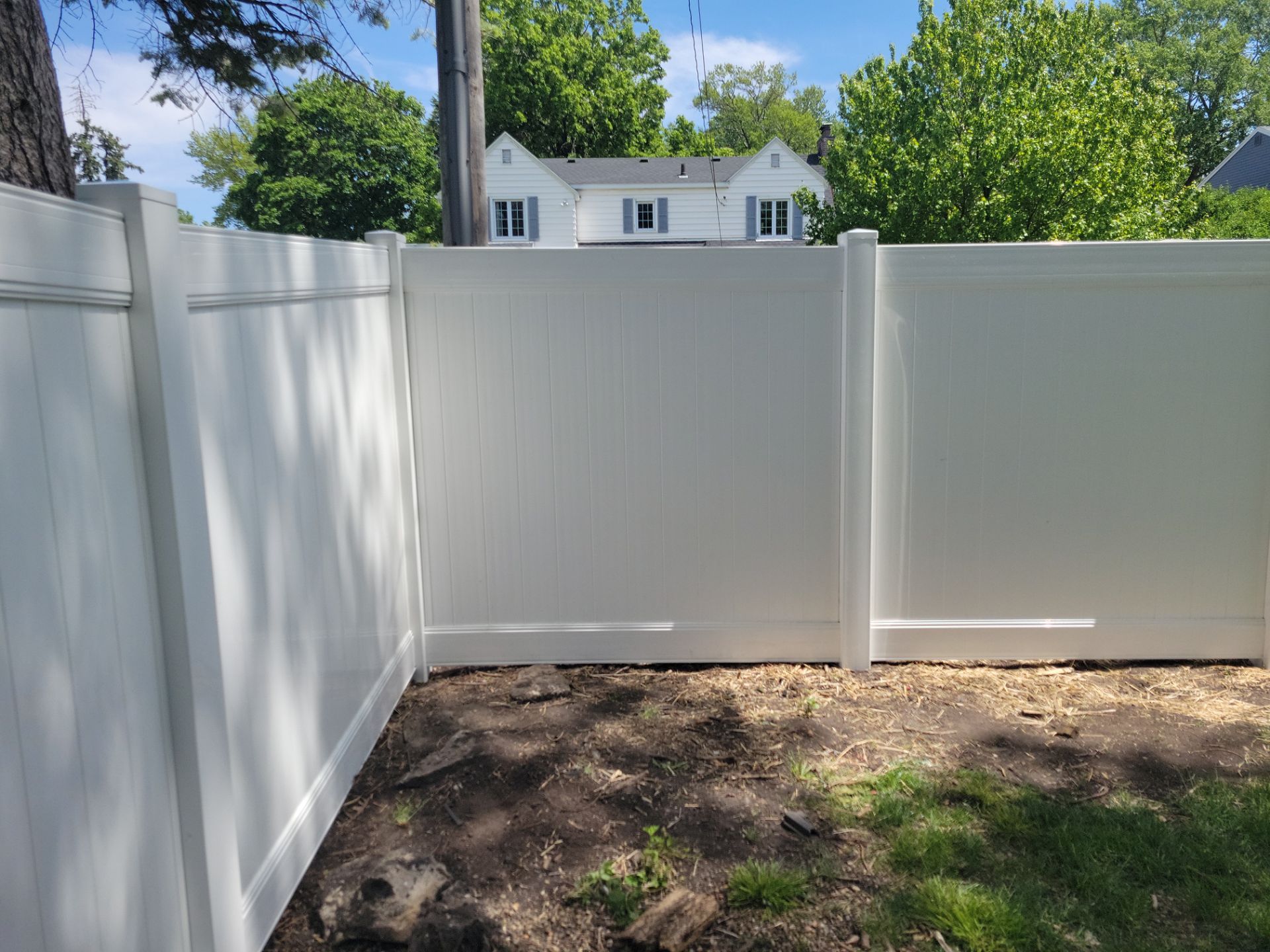 Residential White Vinyl Privacy Fence Installation in Waterloo by Perfect Picket Fence and Stain