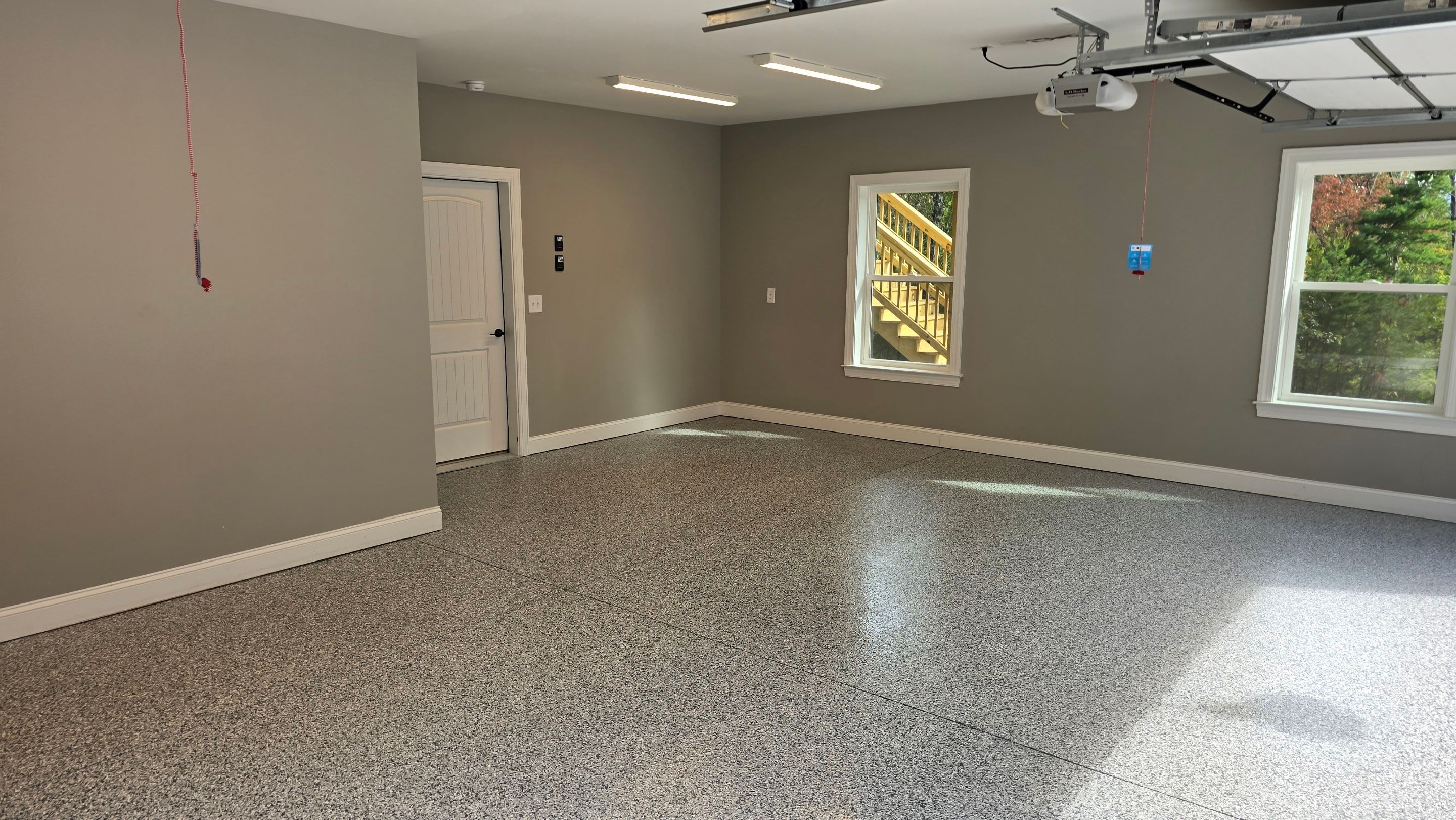 Patio Using Basalt & Garage Using Gravel by Elite Floor Solutions