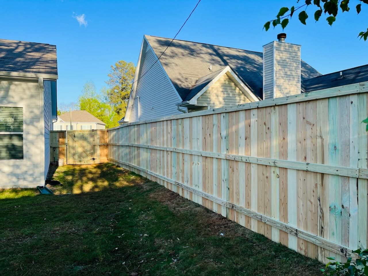 Wood Privacy with Decorative Top Cap by Titans of Timber Fence & Stain