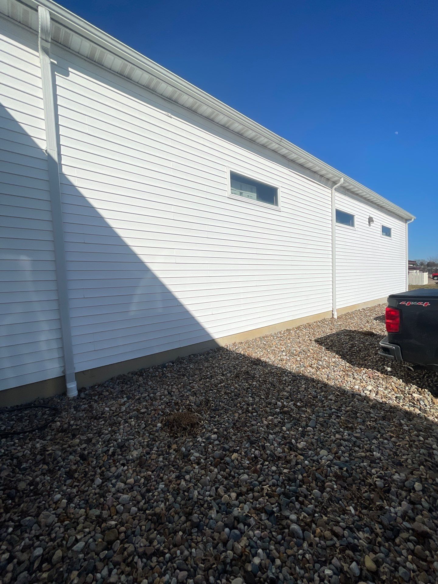 Siding and Stone Installation using Extrerior Porfolio Vinyl Siding and Versetta Stone by EEC  Windows, Siding & Roofing 