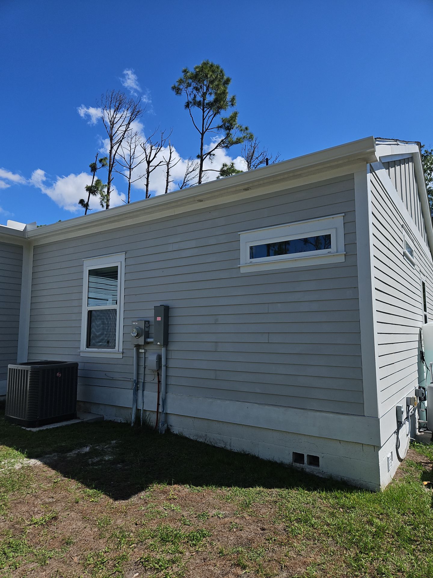 Downspout Installation using 3X4 Elbow Downspout in Port Charlotte FL by Gutter Professors