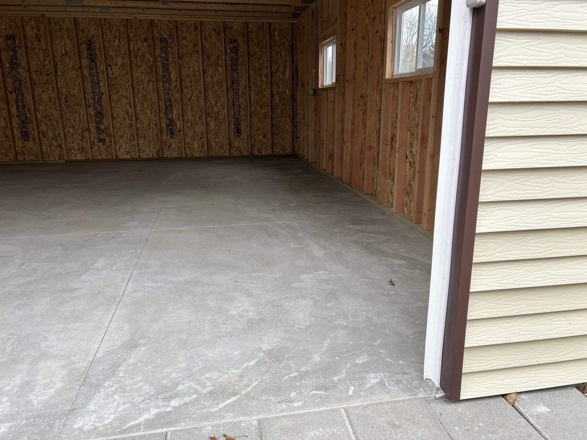 Bring Revival To Your Detached Garage  by Revival Concrete Coatings
