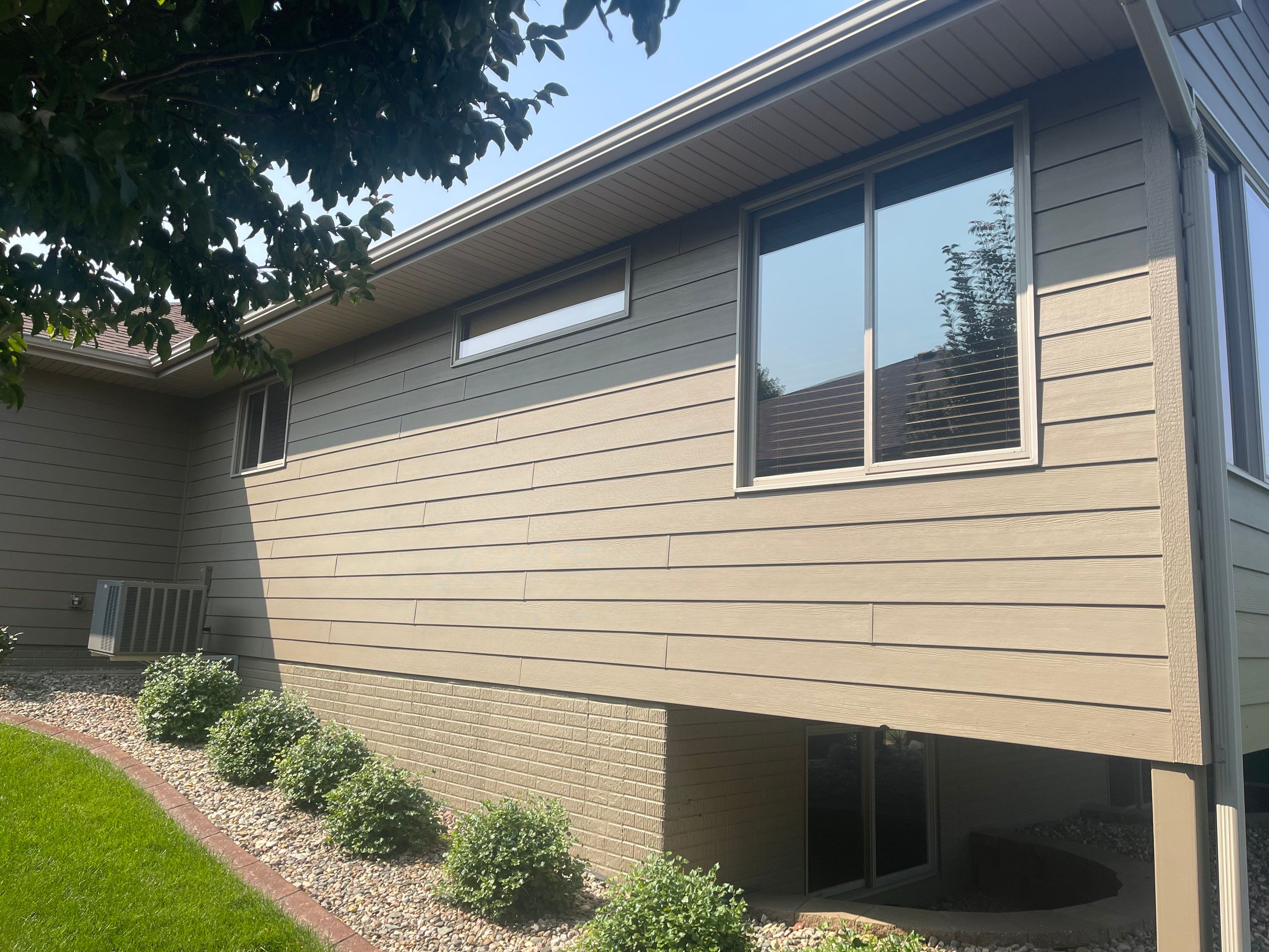Residential Exterior Siding and Trim Painting in Sioux Falls by Select Painting, Coatings & Garage Cabinets