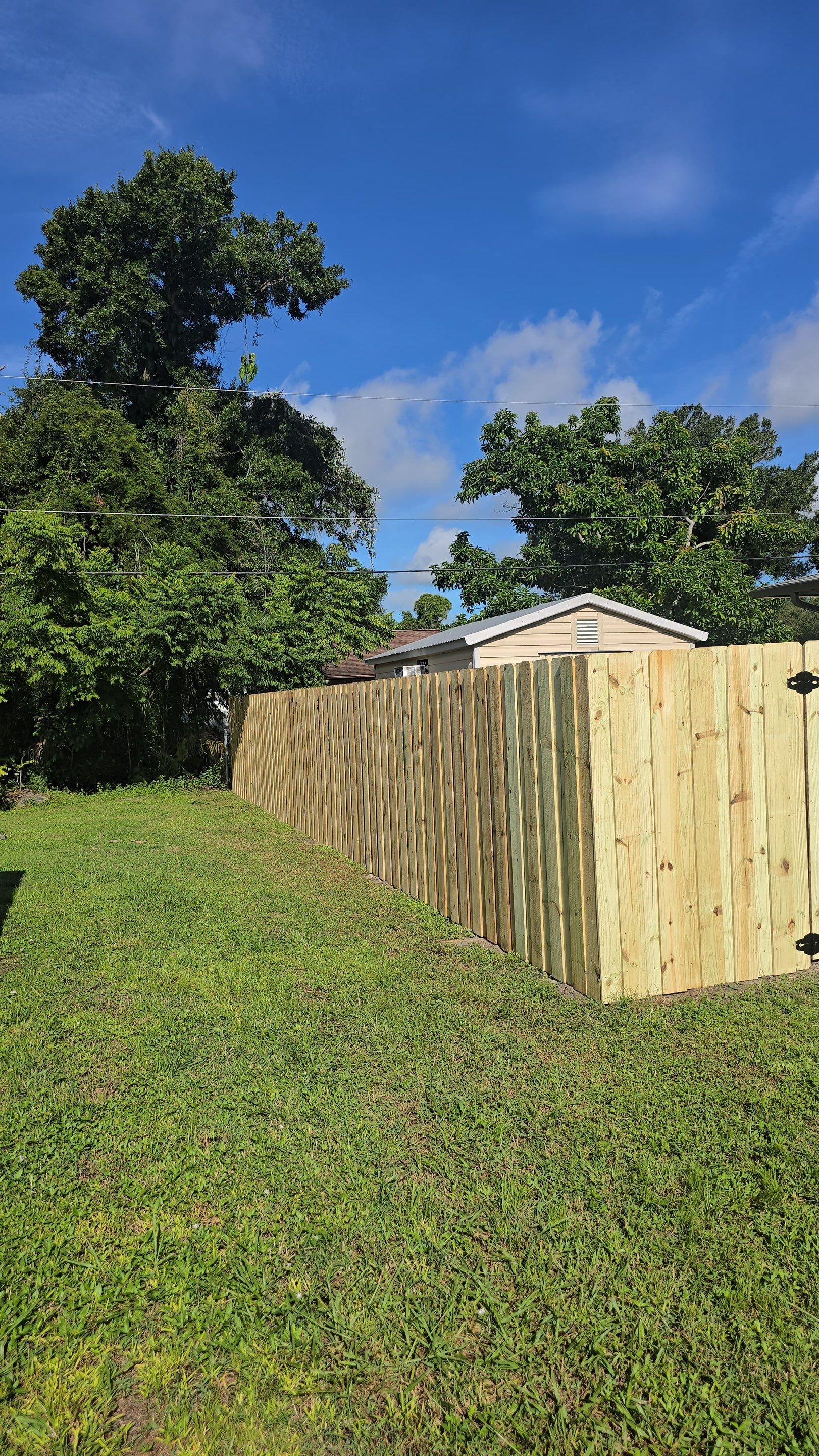 Pressure-Treated Wood Privacy Fence and Gate Installation in North Port by True Fence LLC