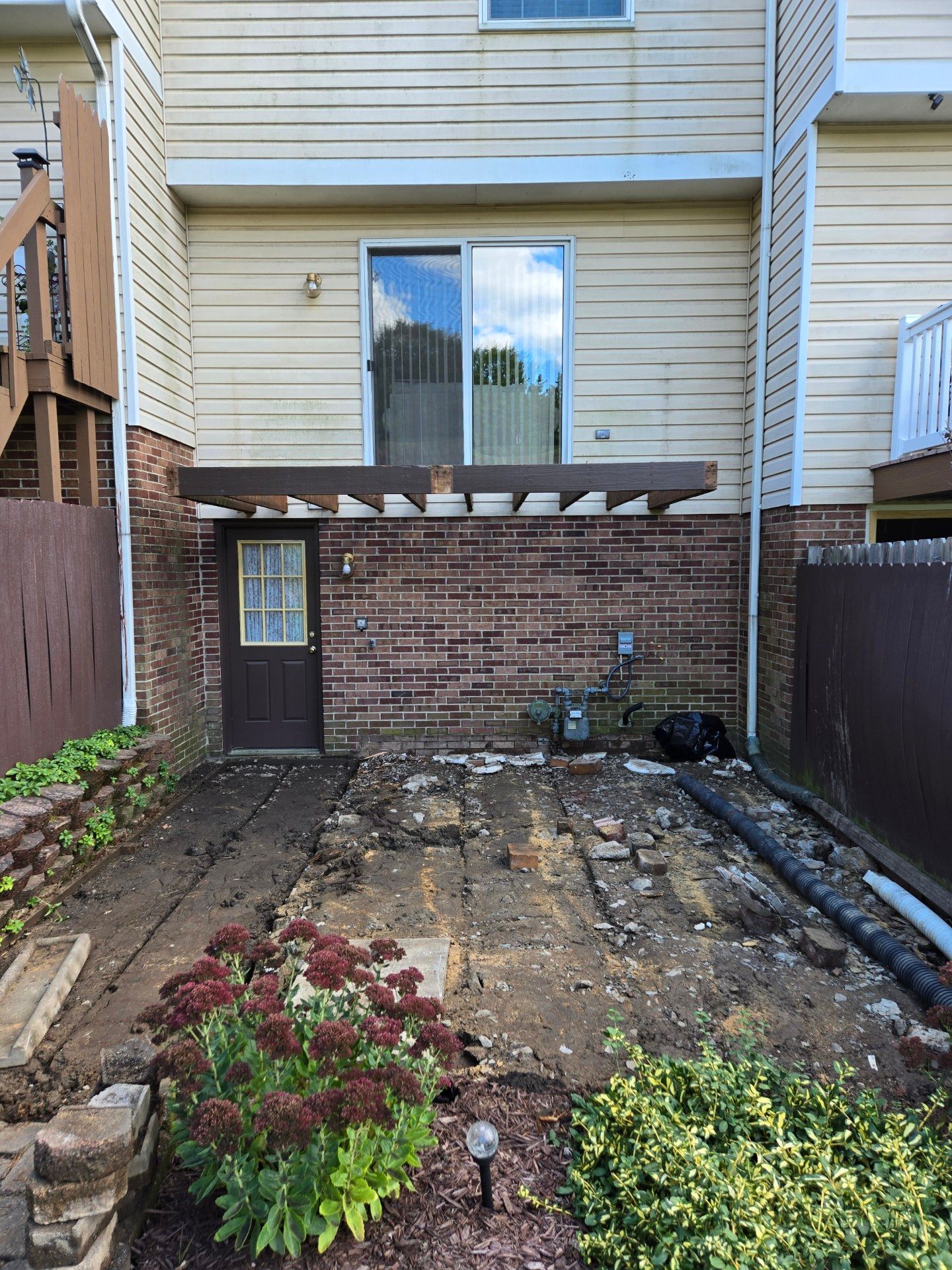 Stamped concrete and redeck  by Cousins Roofing Siding & Decks