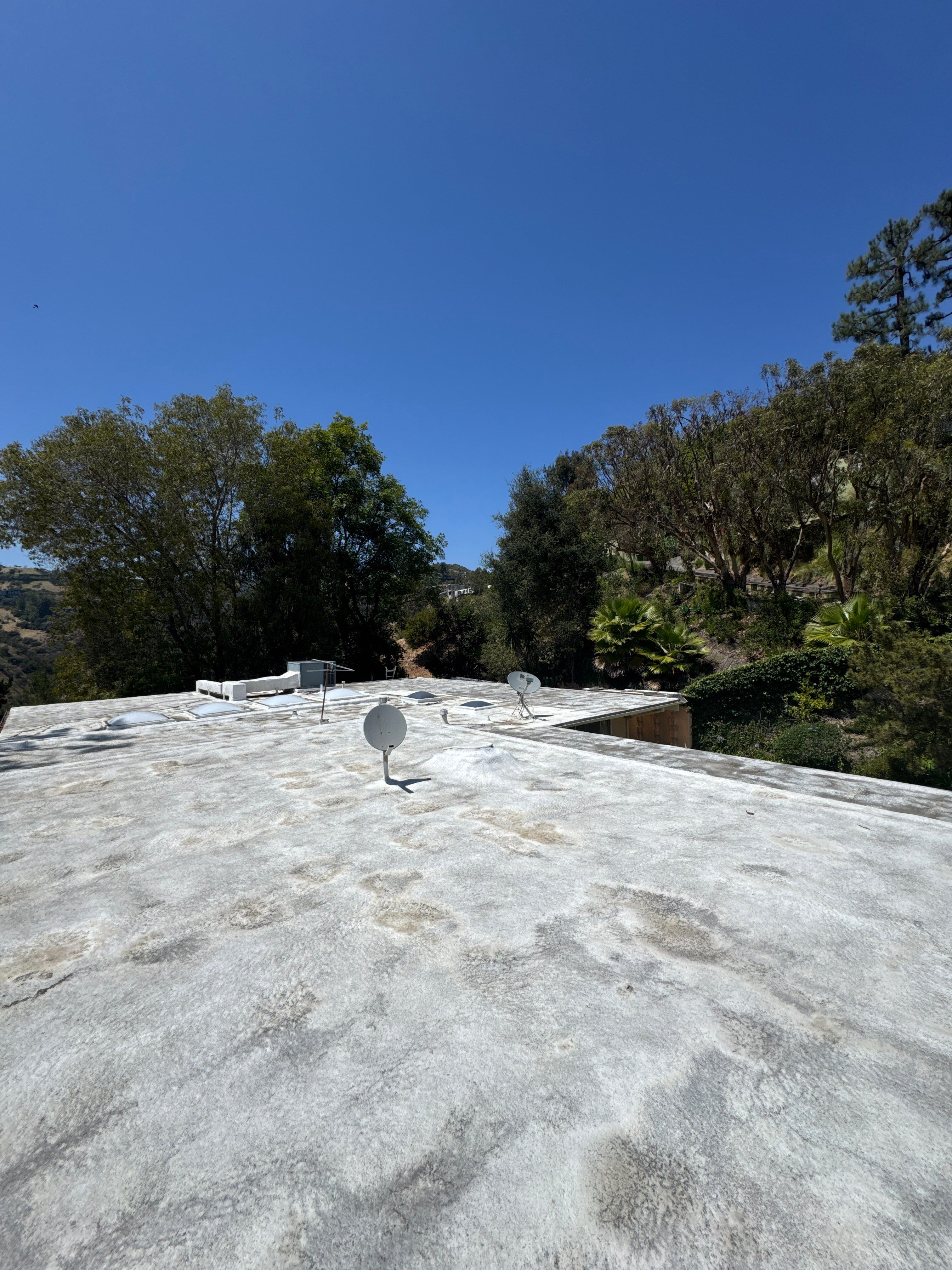 Residential Flat Roof Restoration with Silicone Coating in Brentwood by Hull Brothers Roofing