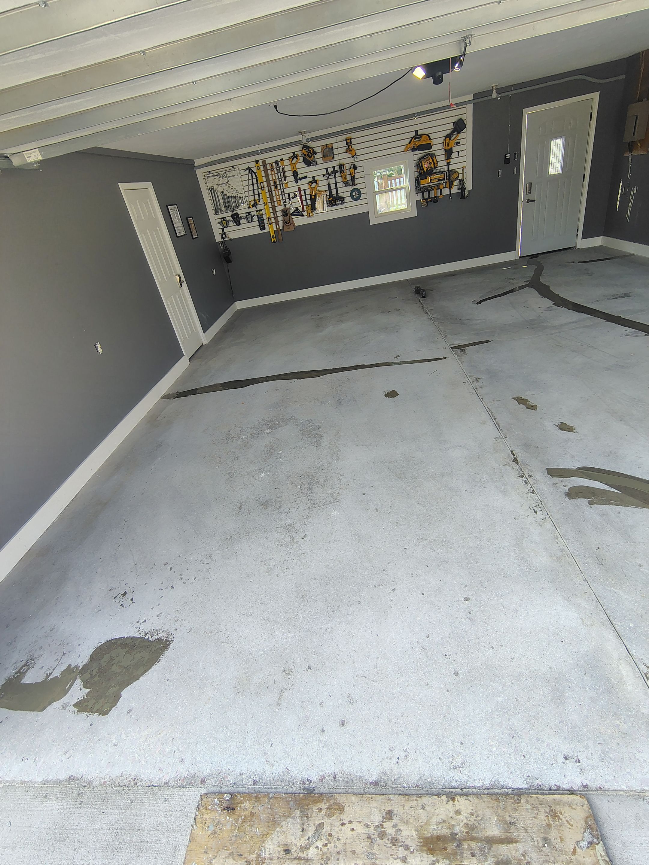 Custom Garage Floor Coating and Backyard Patio Refinishing in Tyndall by Select Painting, Coatings & Garage Cabinets