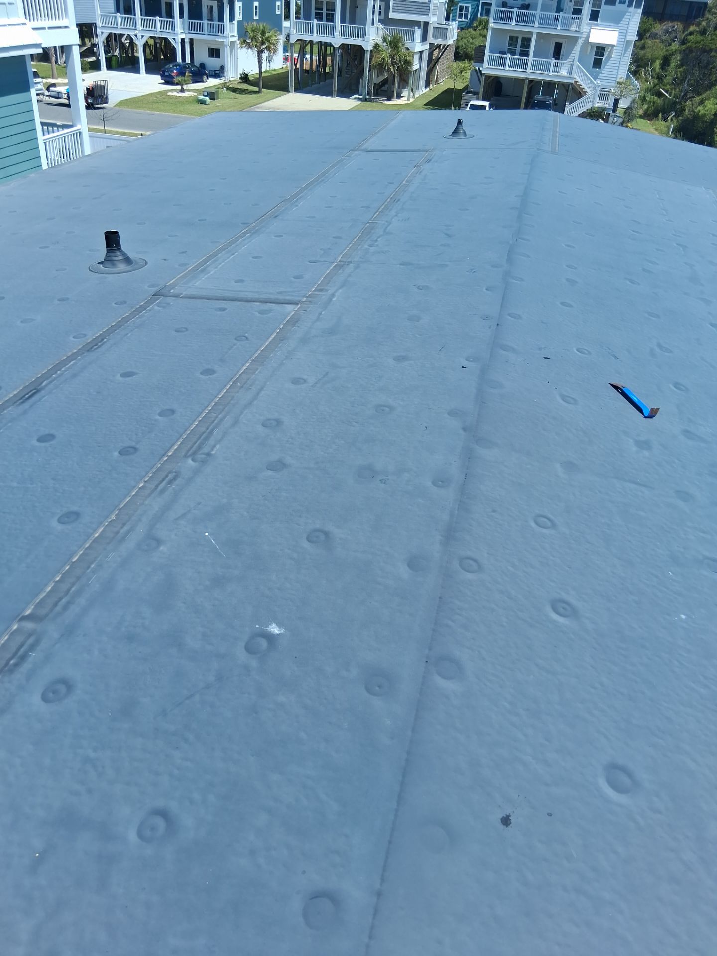 Standing Seam Metal Roof Replacement in Oak Island, NC by RGR Construction and Roofing, LLC