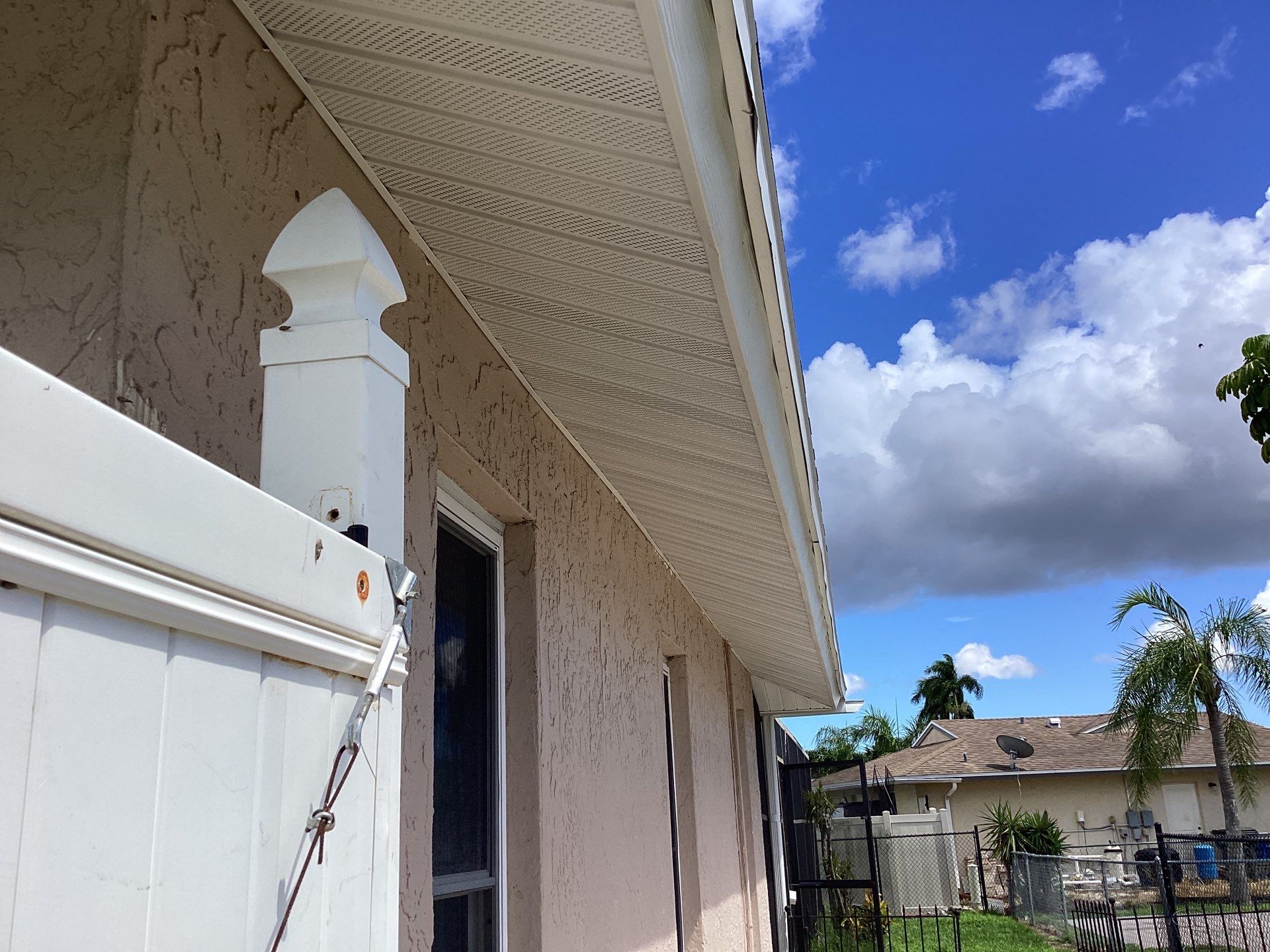 White Seamless Gutters and Splash Guards in Fort Myers FL by Gutter Professor by Gutter Professors