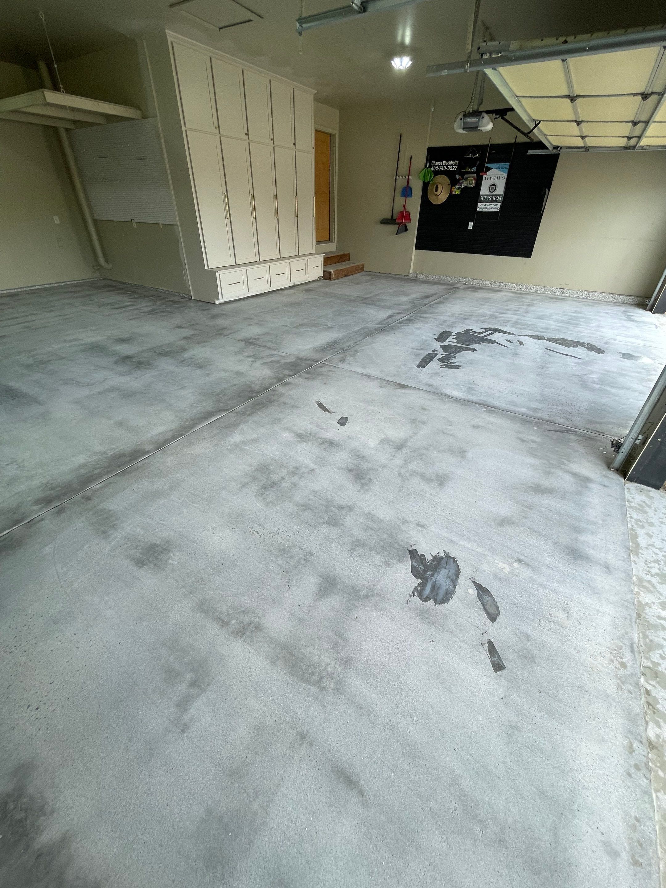 Cabin FEver Flake Garage Floor Coating Installation in Sioux Falls by Select Painting, Coatings & Garage Cabinets