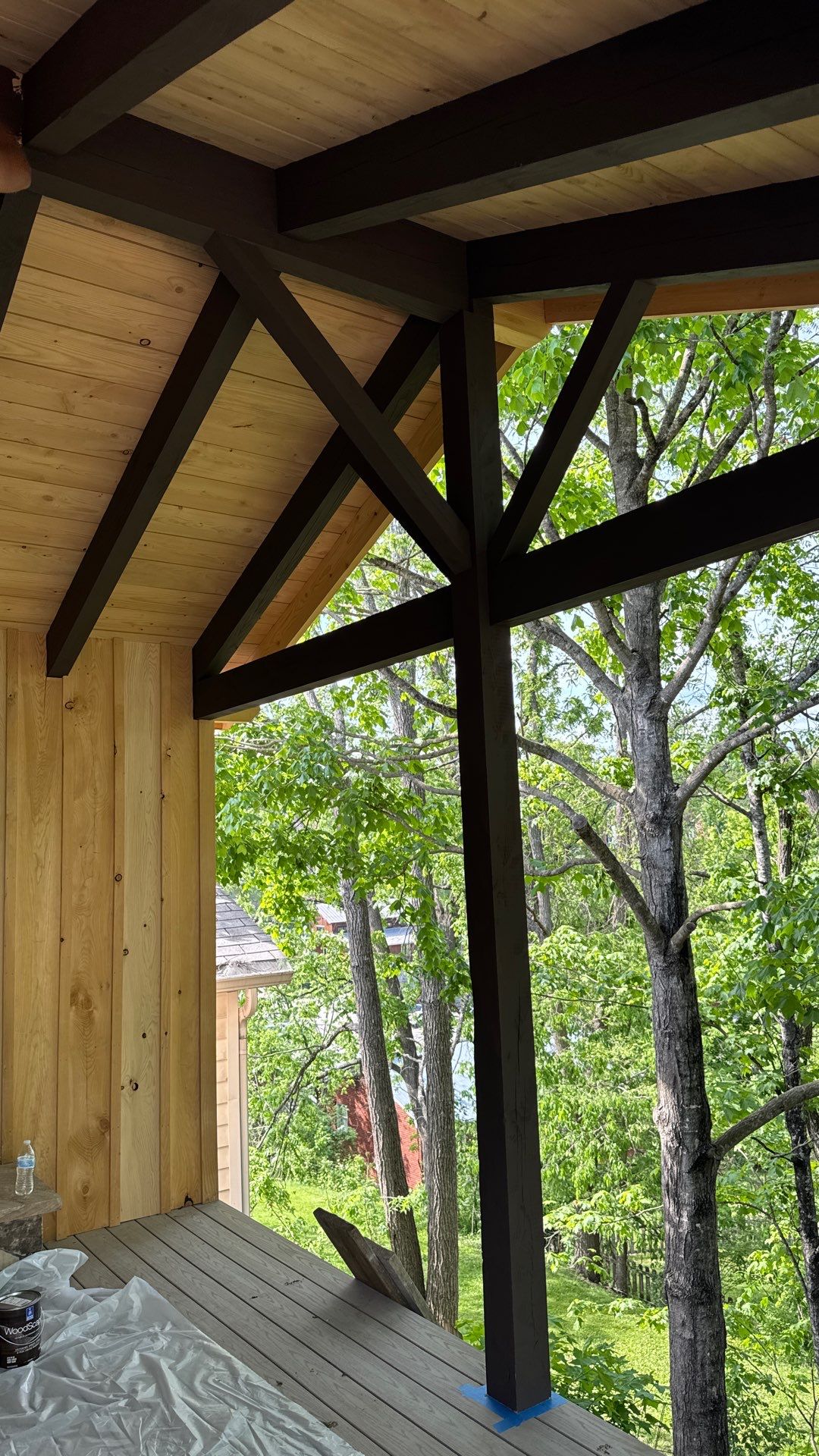 Custom Composite Deck with Stone Fireplace and Modern Cable Railing by Walnut Hollow Decks & Outdoor Living