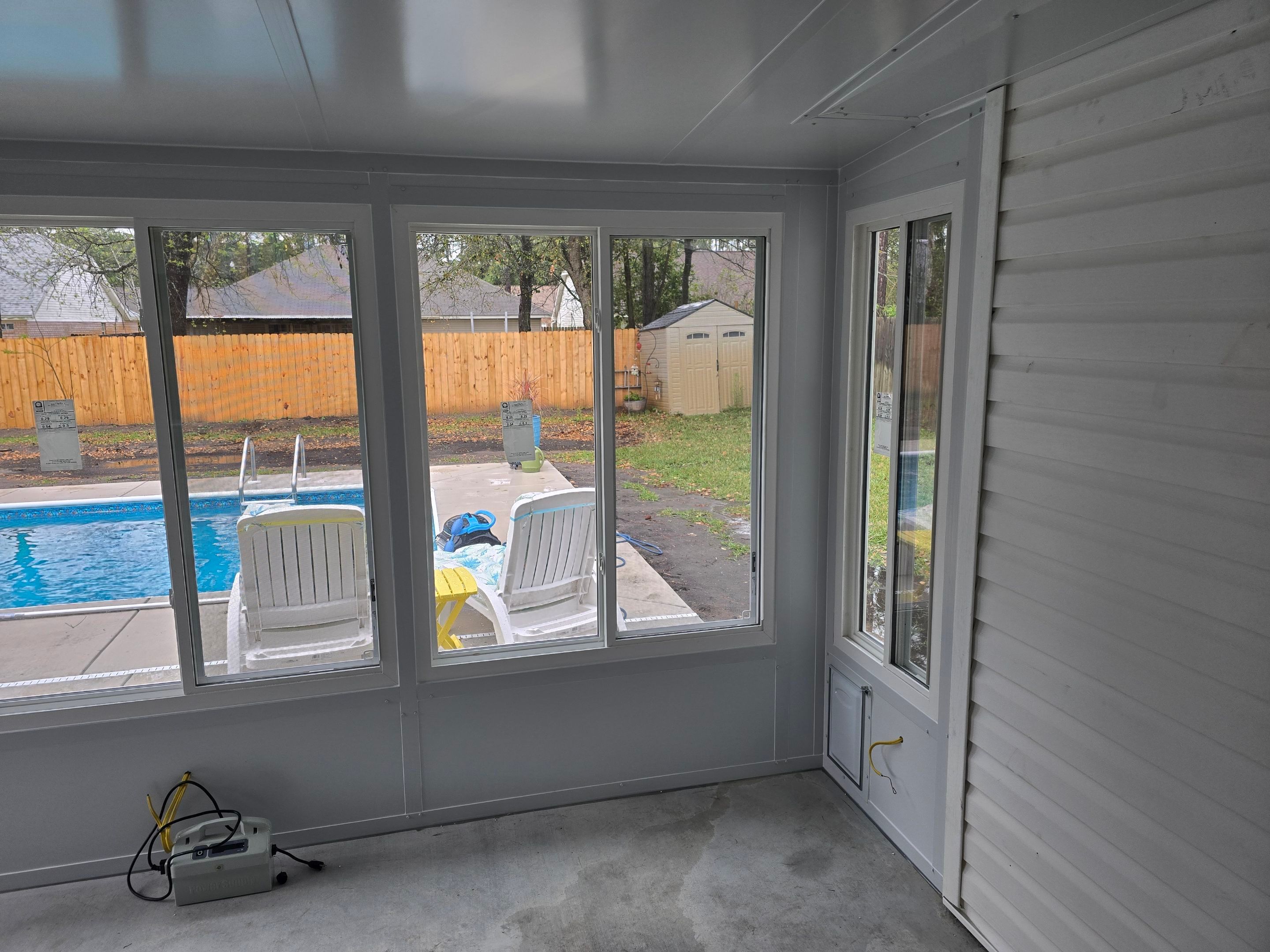 Poolside Glass Room in Gulf Breeze by Titan Sunrooms
