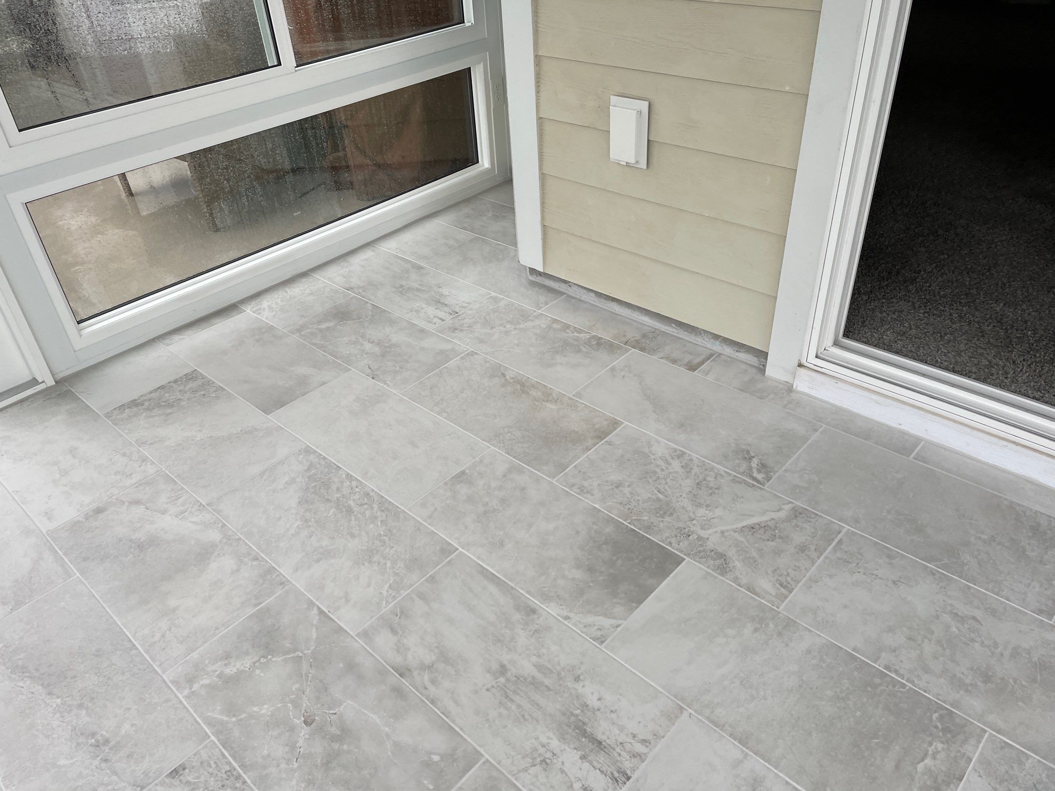Amazing Tile Transformation After Enclosed Windows Added to Sunroom by Footprints Floors of Coastal Carolina
