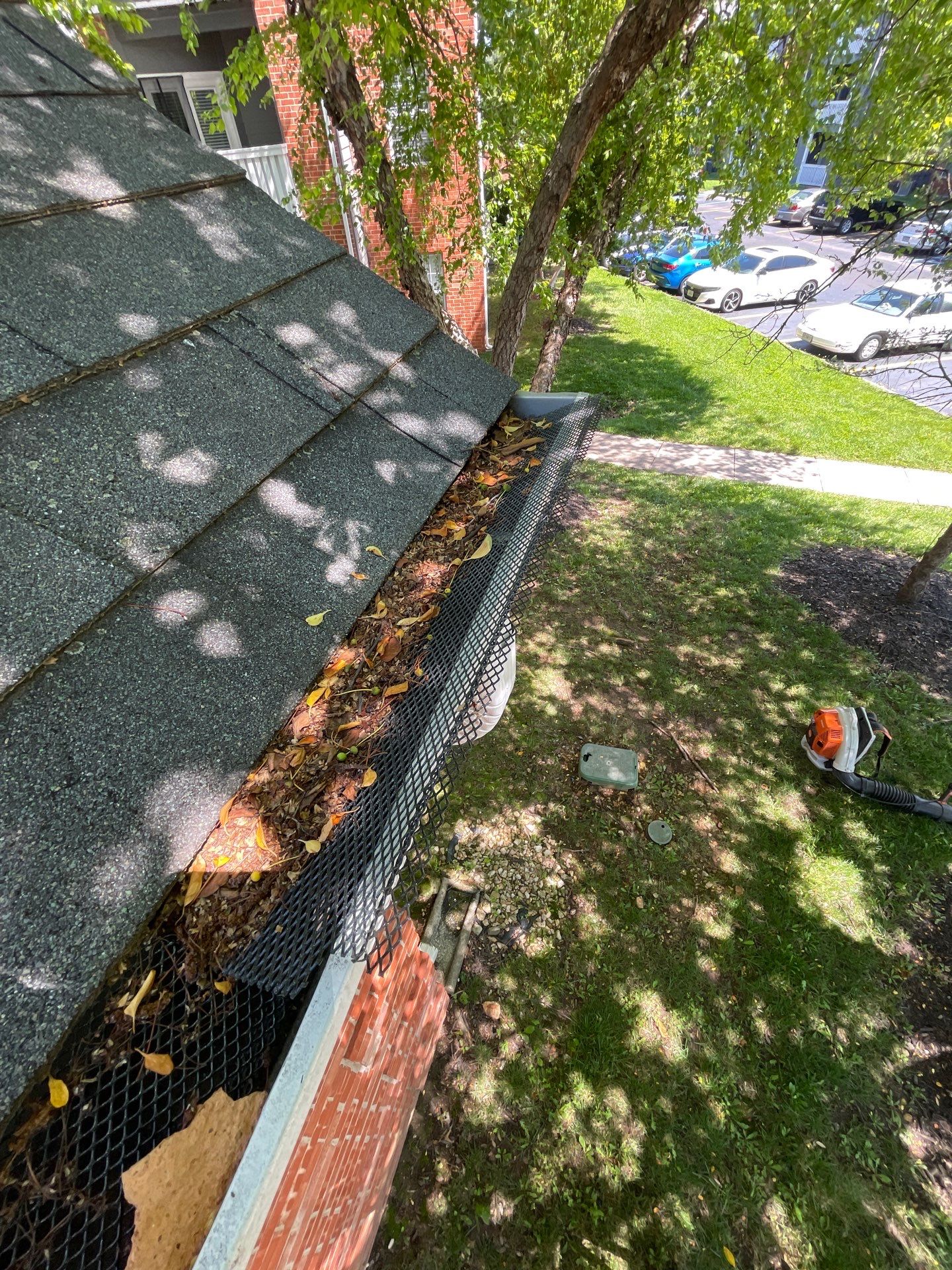 Commercial gutter cleaning Springfield, MO before photo with filled gutters