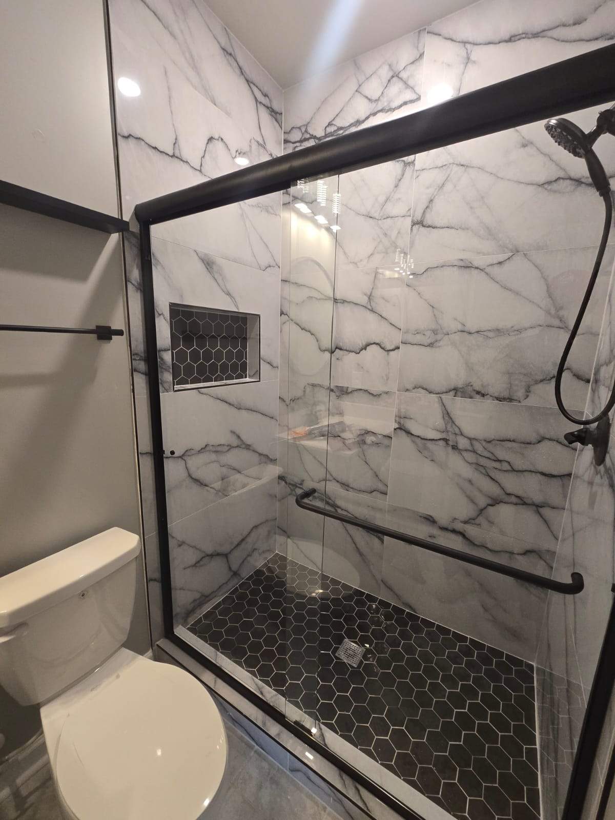 Tub to walk-in shower conversion by Prudencio