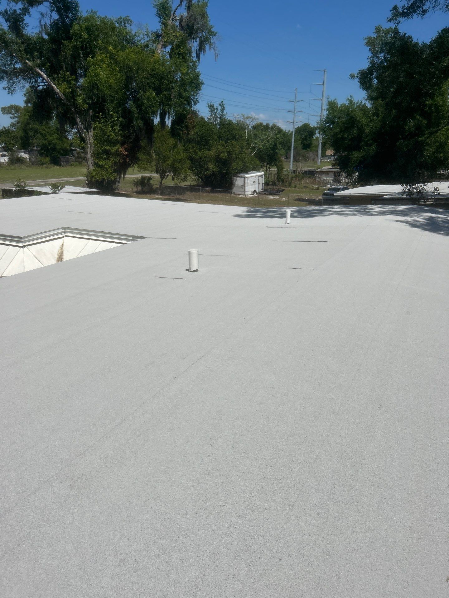 Flat Roof Replacement and Wood Decking Repair in Maitland by Tip Top Roofing Co., Inc.