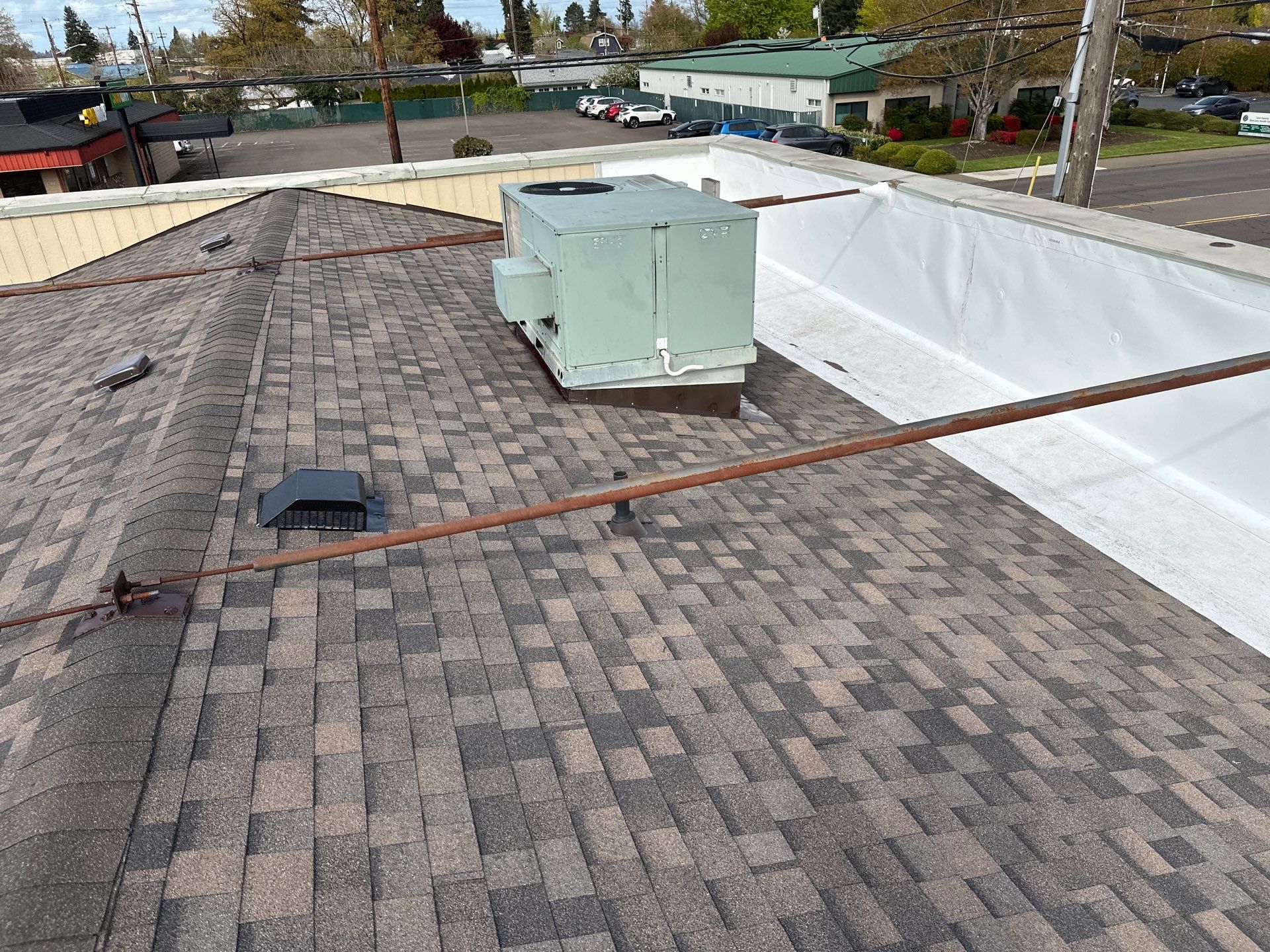 Commercial Roofing Installation using IKO Dynasty & GAF 60Mil TPO by Orezona Building & Roofing Company, Inc.
