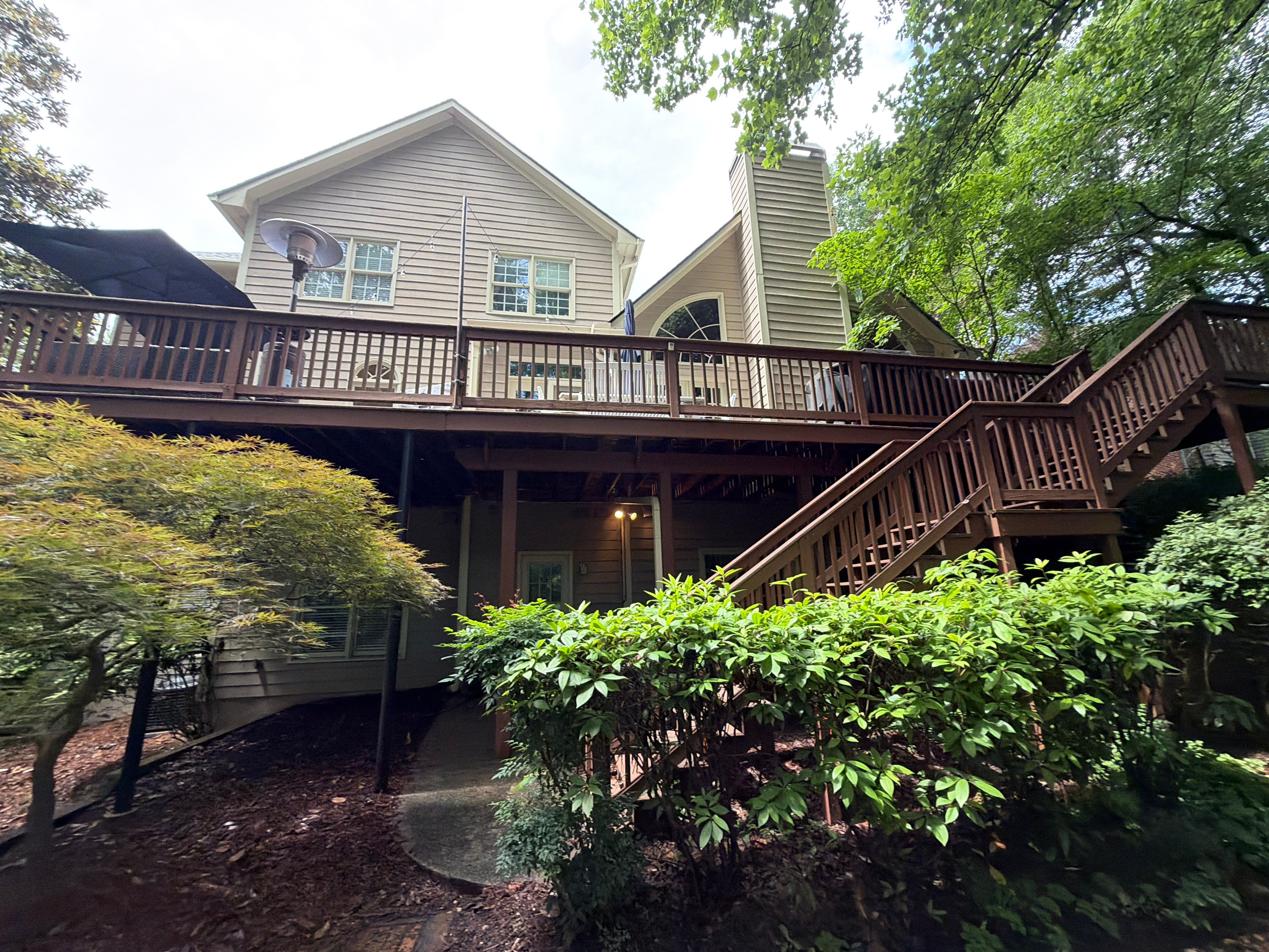 Full James Hardie Siding Replacement and Trex Deck Resurface in the Saddle Color by Nelson Exteriors 