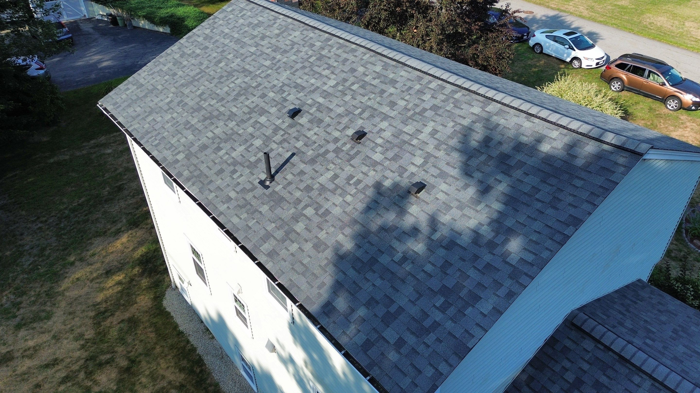 Complete Roof Replacement with Chimney Flashing, Gutter Guard System, and Vinyl Siding Repairs by Mighty Dog Roofing of Greater Middlesex County