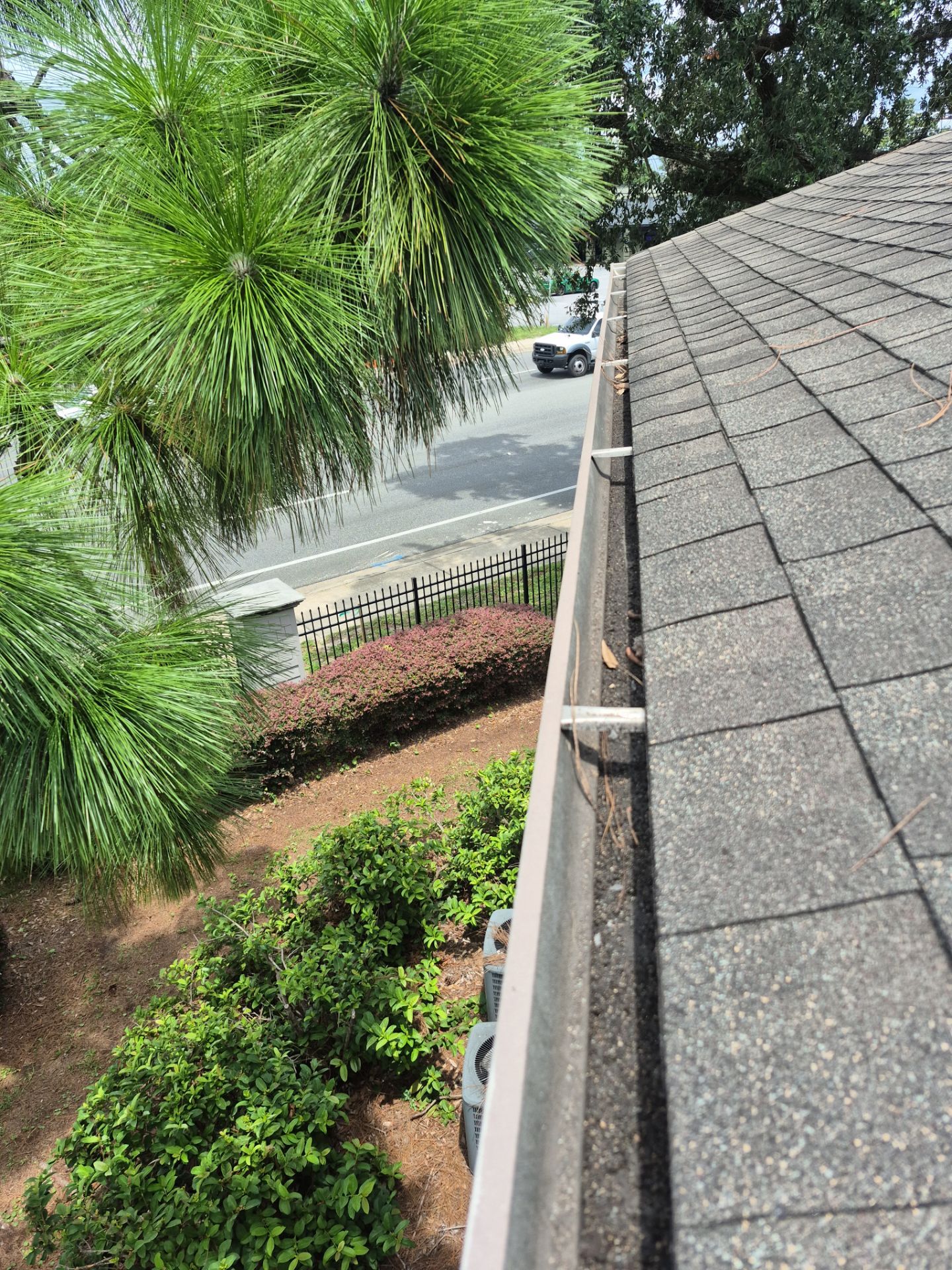 HOA gutter cleaning in Pinehurst & Southern Pines, NC, after  photo showing full gutters.