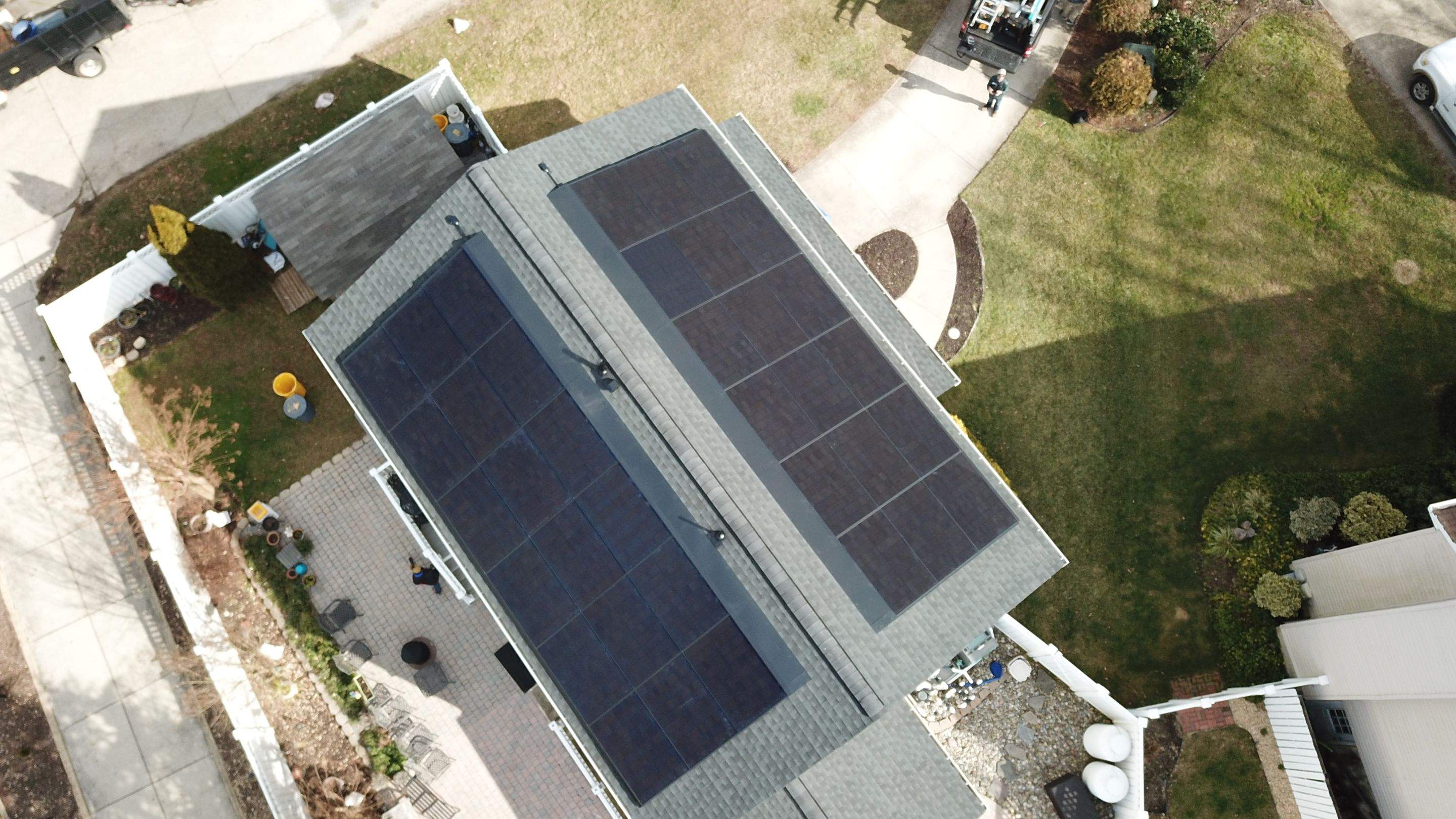 Roof Replacement with GAF Decotech integrated solar panels by American Home Contractors