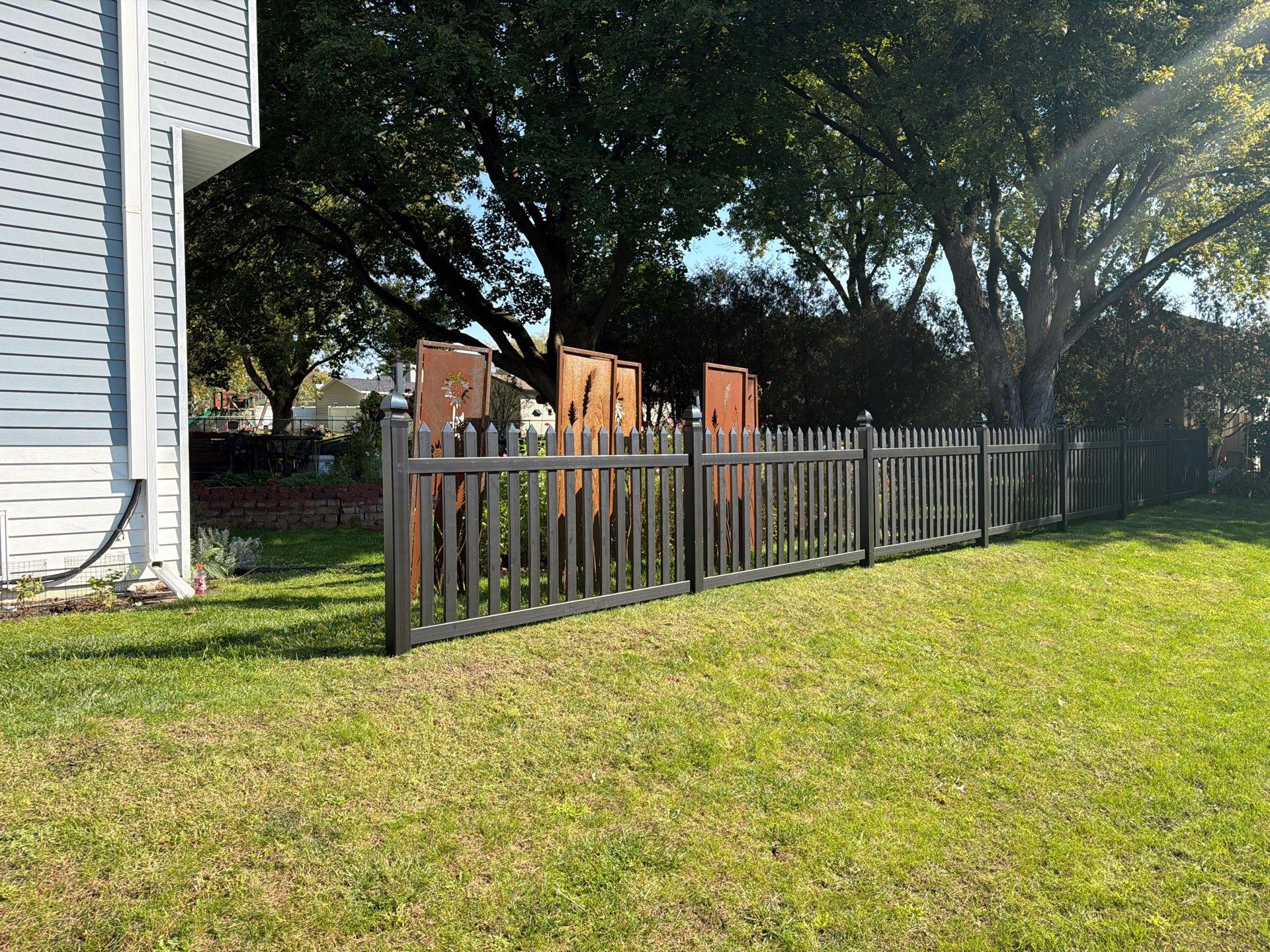 Black Vinyl Spaced Picket Fence Installation in Cedar Falls by Perfect Picket Fence and Stain