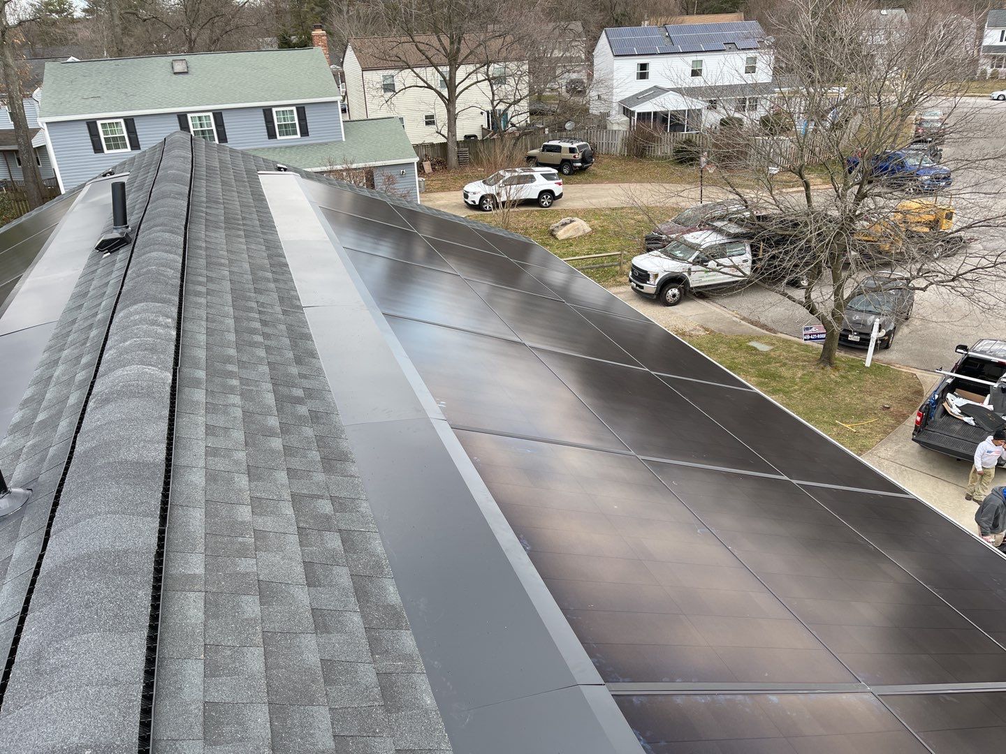 Roof Replacement with GAF Decotech integrated solar panels by American Home Contractors