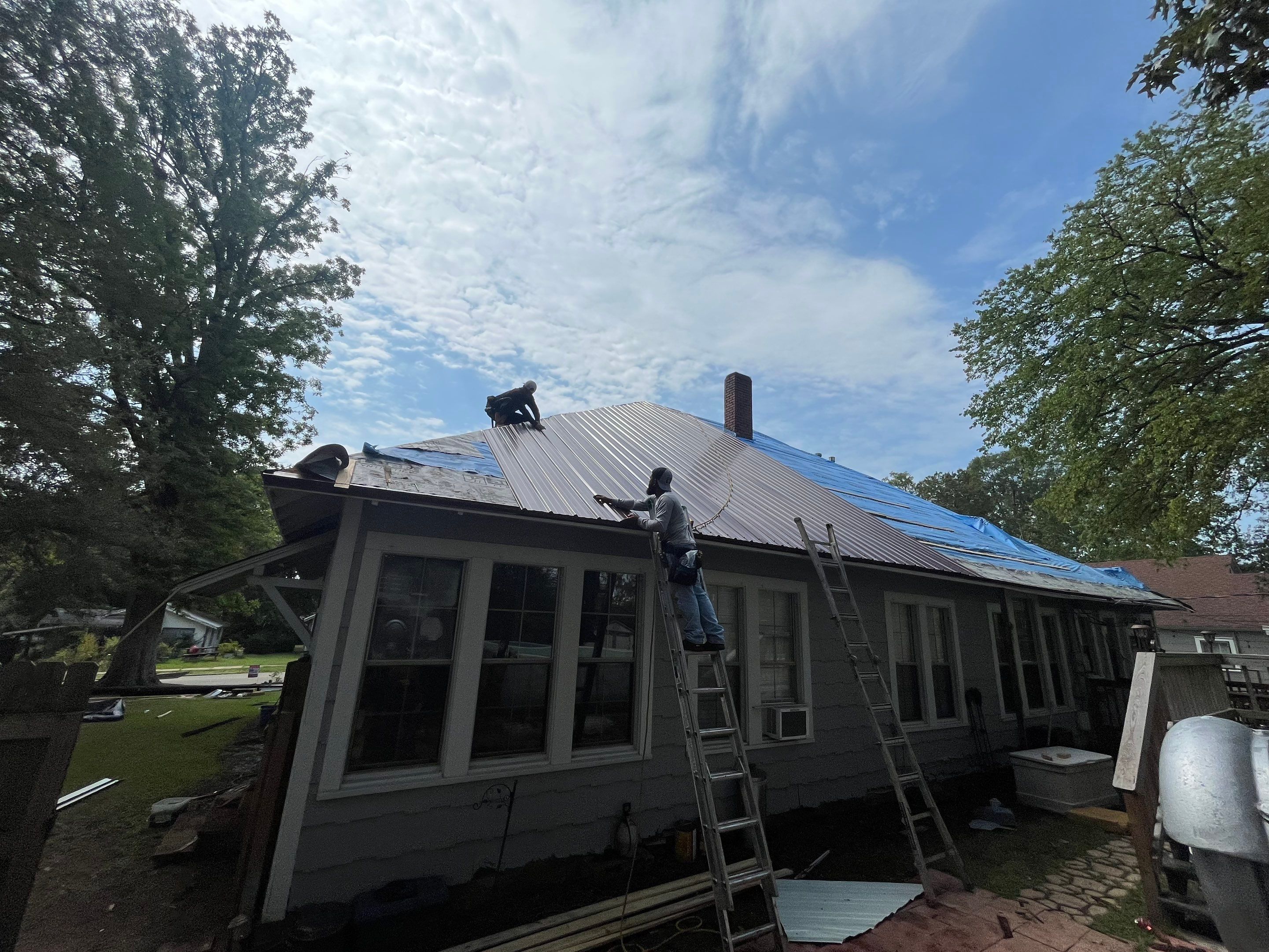 Residential Metal Roof Replacement using Reed's Metals: Colored Residental Panel (Burgundy) by Hostetler Roofing