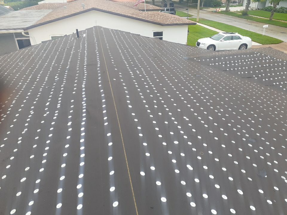 Residential Roofing Installation using 1" Nail strip metal roof by BLUES BROTHERS ROOFING