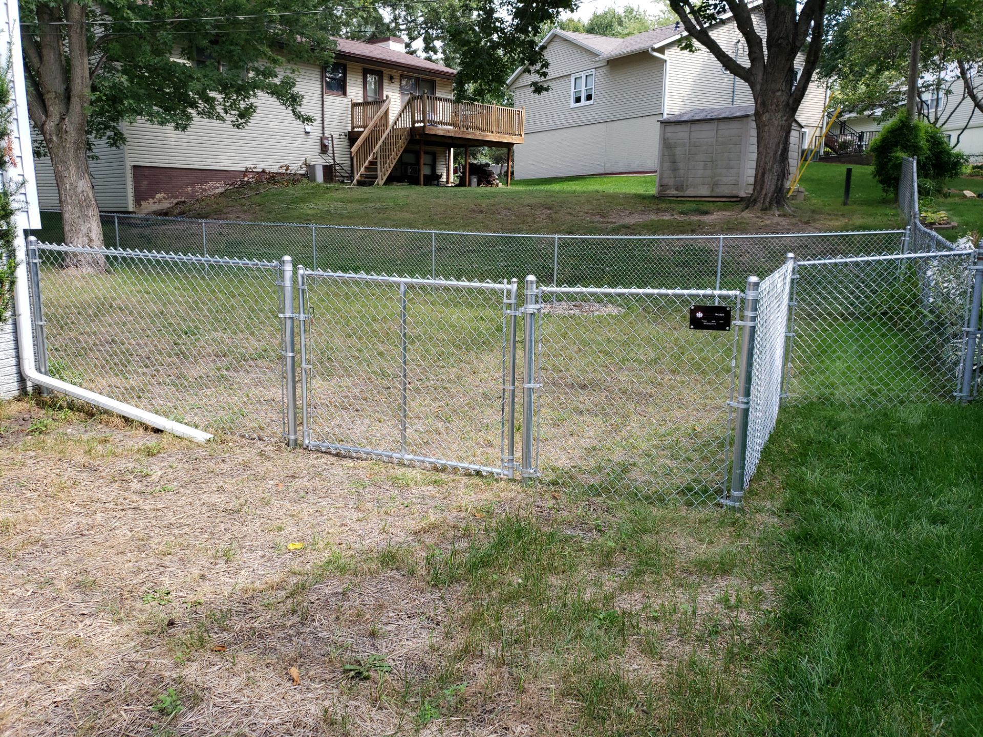 Galvanized Chain Link Backyard Fence and Gate Installation in Cedar Falls by Perfect Picket Fence and Stain