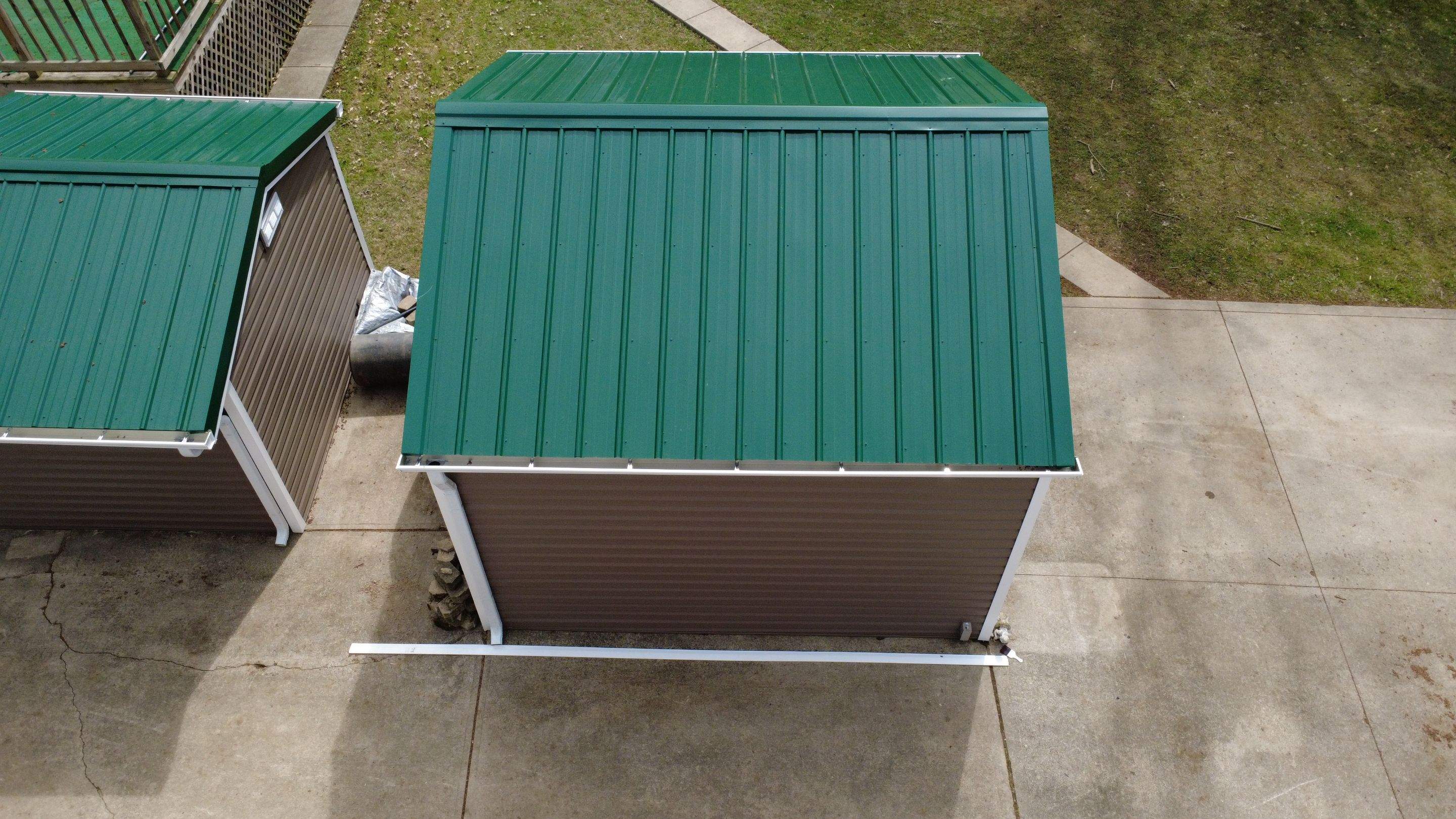 Green Metal Roof Installation and Exterior Renovation in Thornville by Canopy Contracting