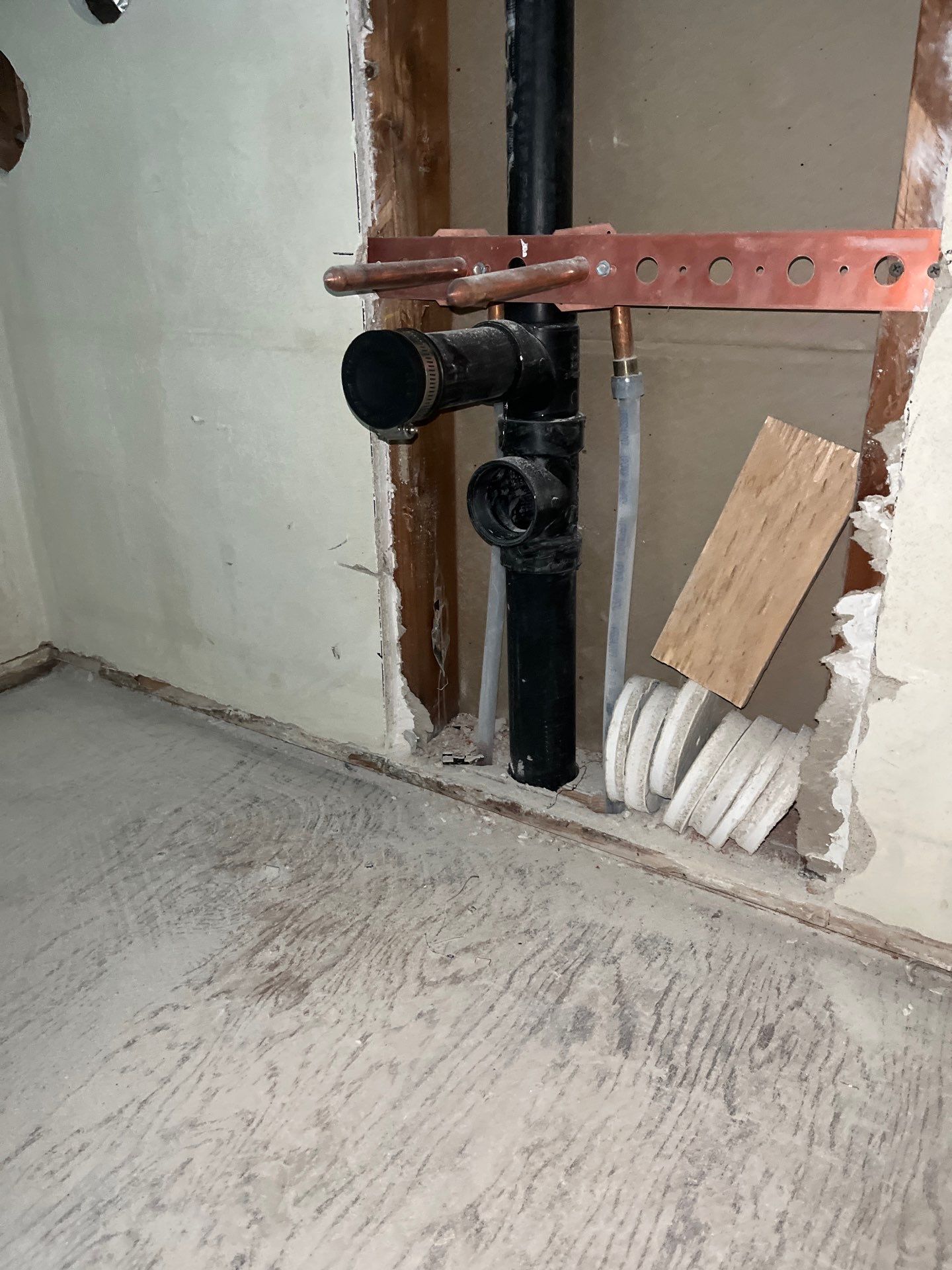 Installation of New Tall Black Piping (Wall to Ceiling) & Underground Piping by Us Plumbing