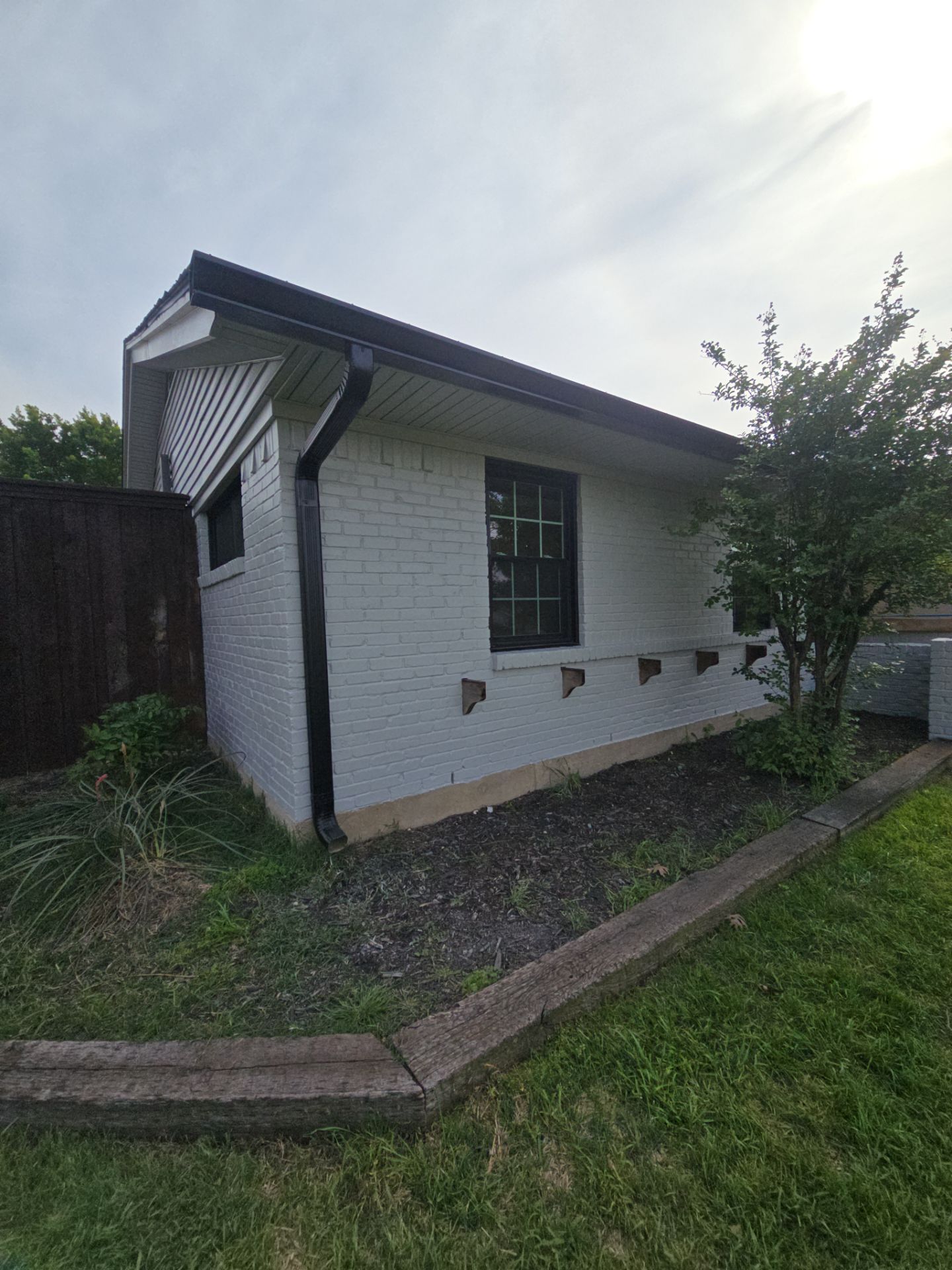 Exterior Home Paint Project with Different Surfaces by SLM General Contractors & Roofing