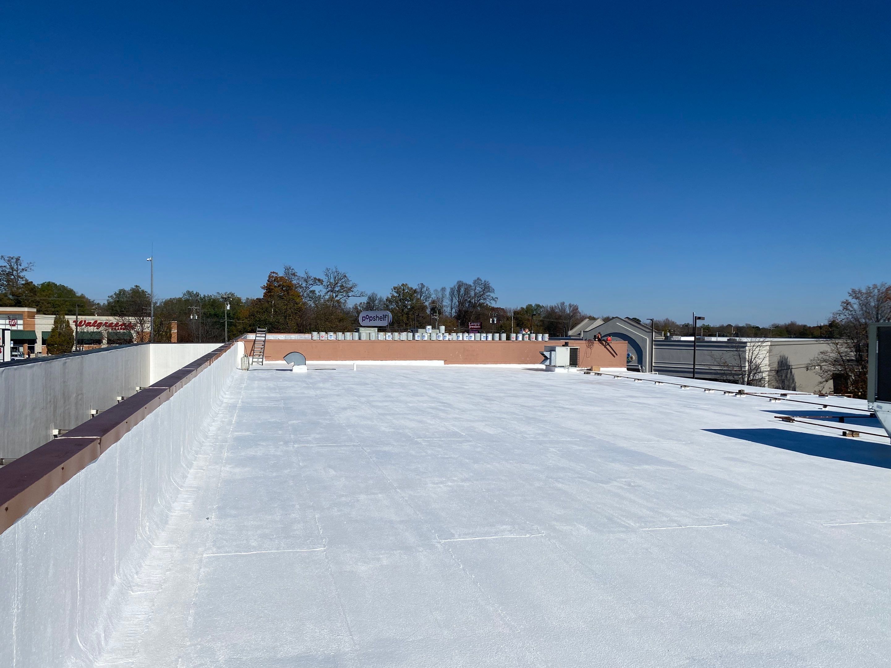 Commercial Coating using Poly Urerthane and Silicone Coating by Just In Time Roofing and Restoration