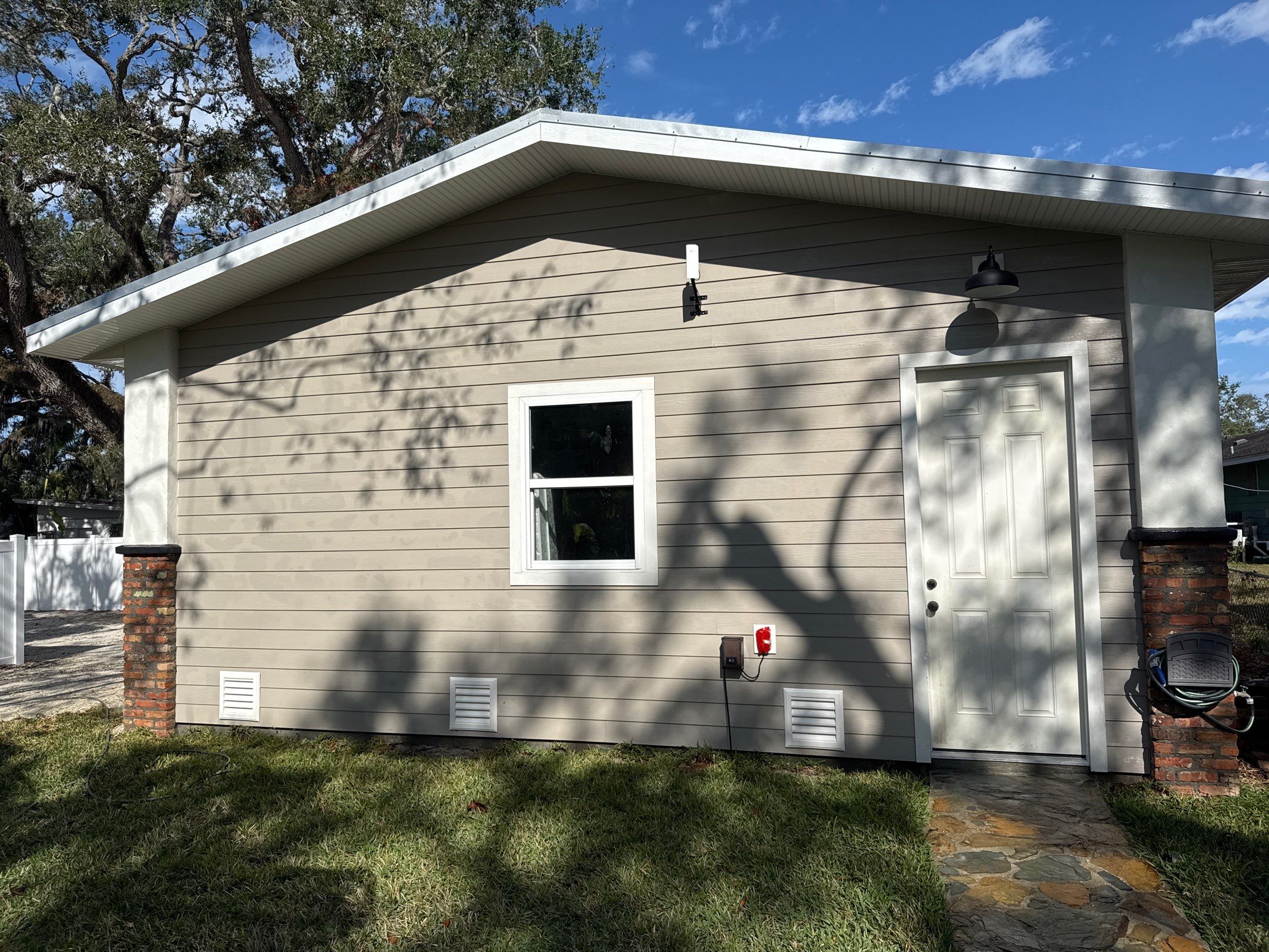 2-Story House Wash and Garage Pressure Washing in Palmetto, FL by Sunshine AquaWash