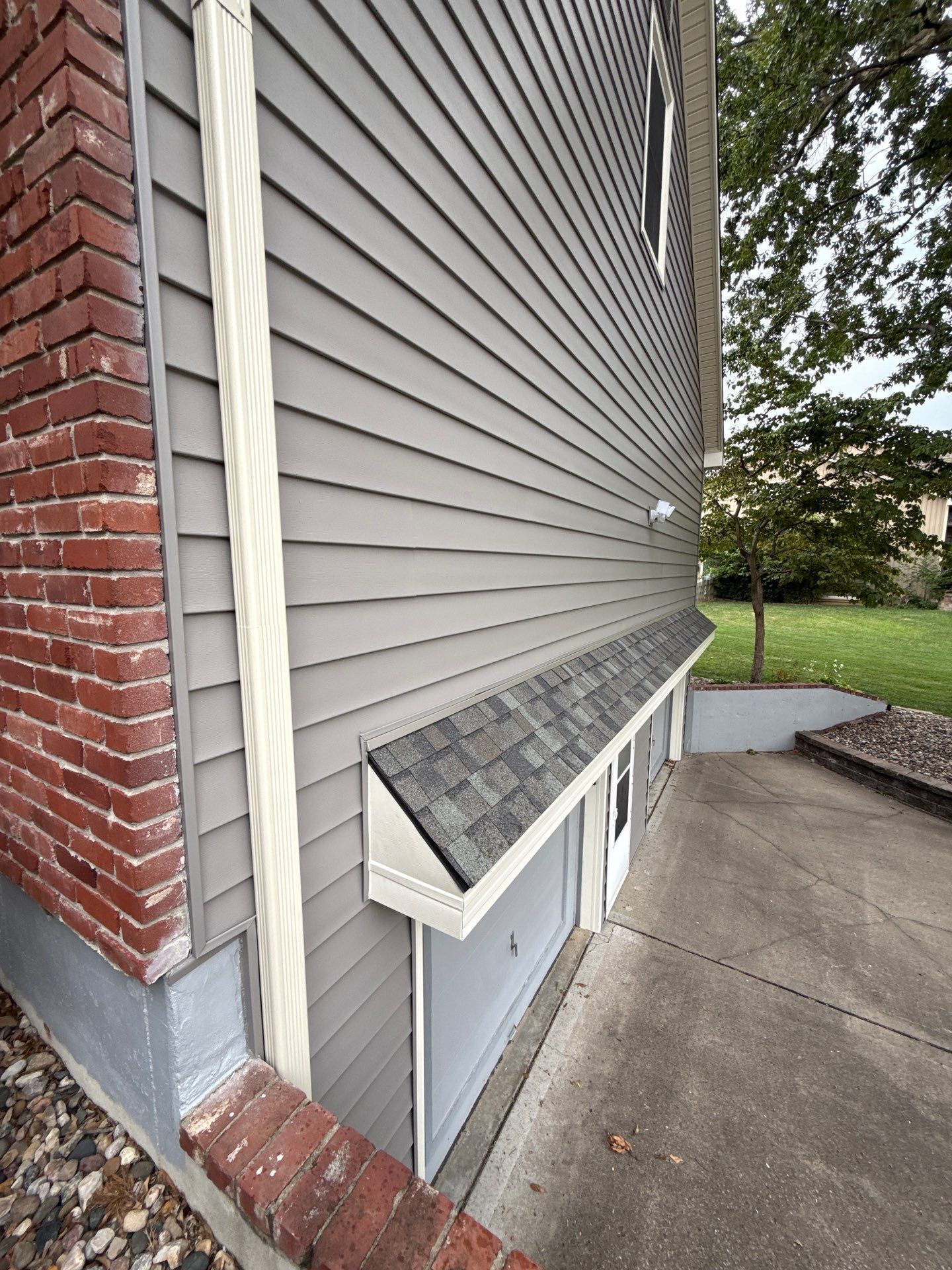 Whole Home Siding Replacement and Gutter Installation in Gladstone by EEC  Windows, Siding & Roofing 