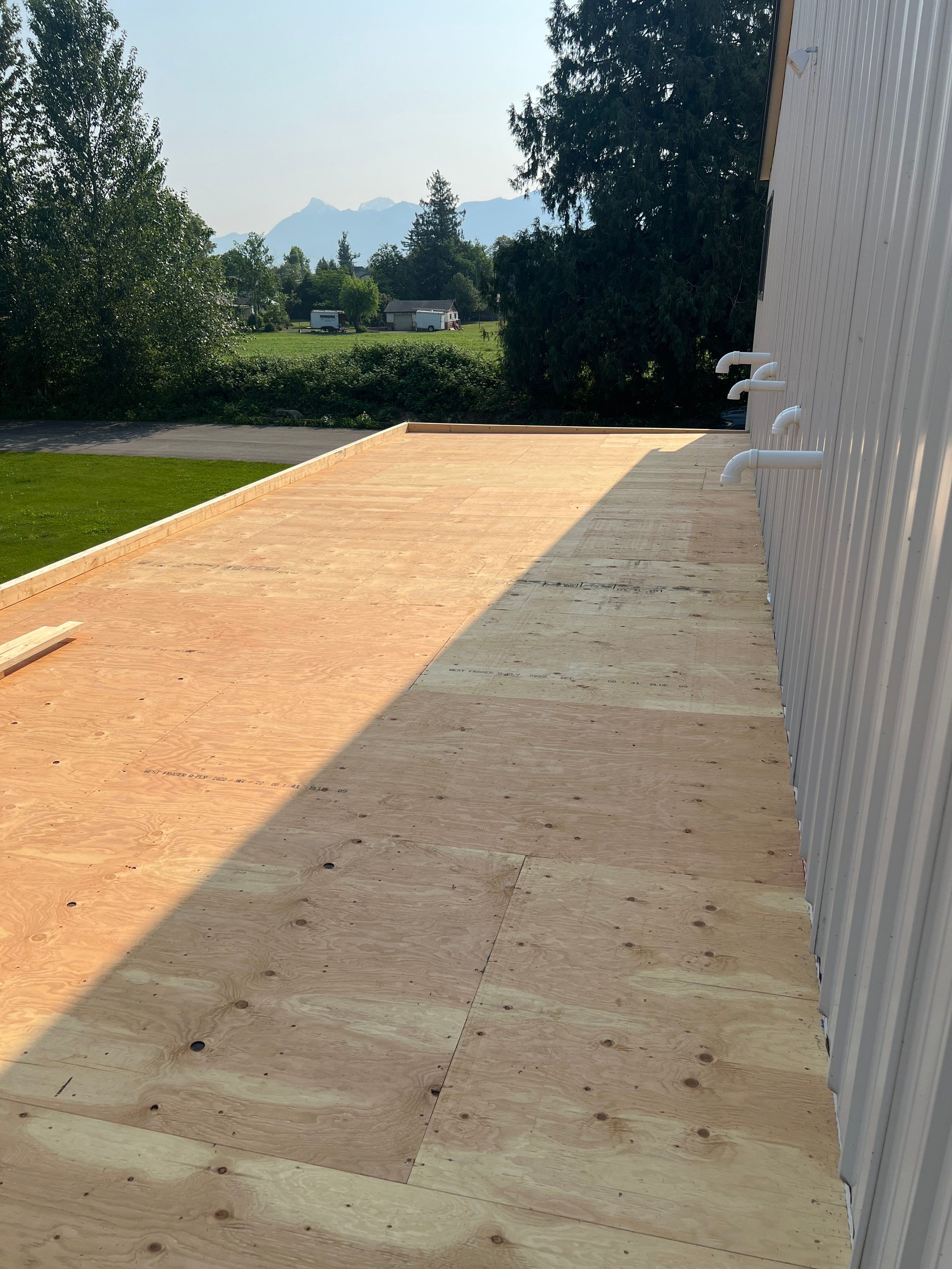 Residential Shop flat roofing Installation using Durolast membrane by Top Notch Roofing Inc