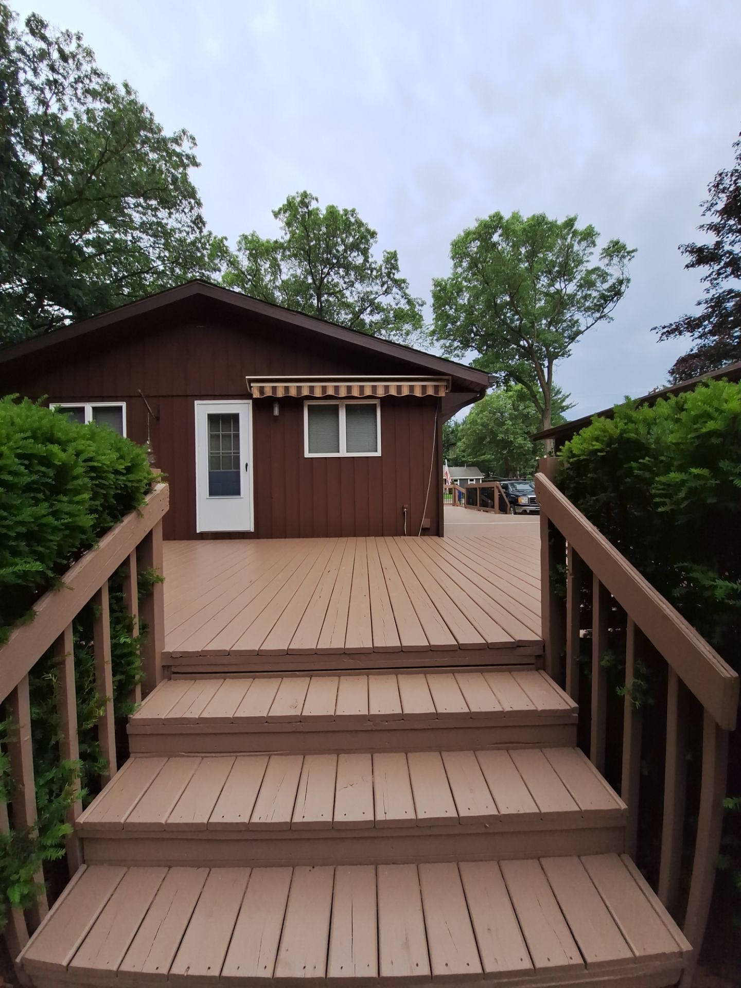 Muskegon Deck Restoration with Pressure Treated Railings and Wood Staining by Gordon Painting