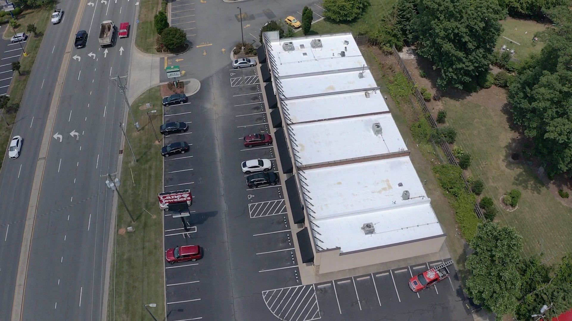 Commercial Roof Coating using Fiberseal basecoat and Silicon Topcoat by Just In Time Roofing and Restoration