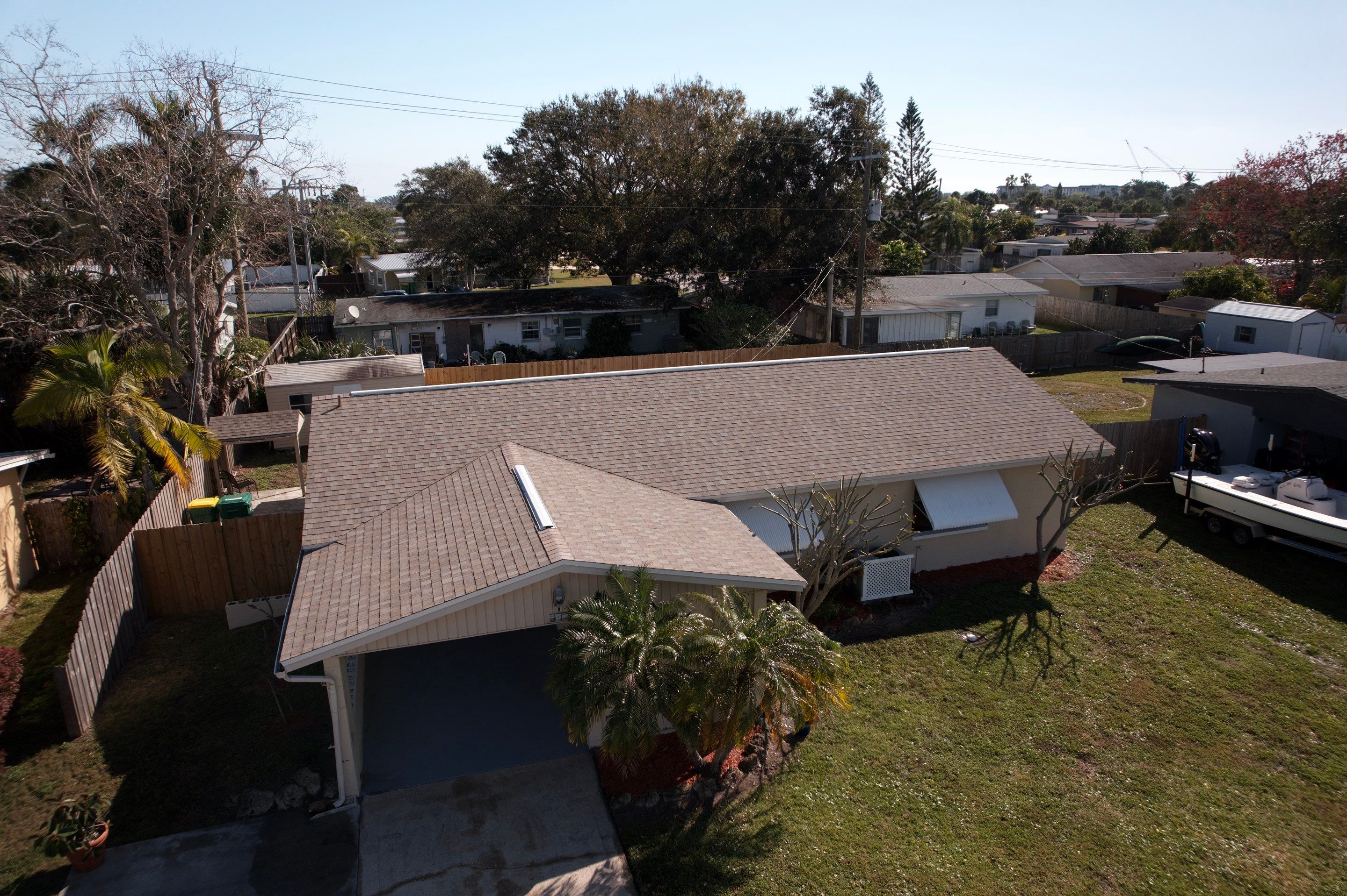 Complete Asphalt Shingle and Flat Roof Replacement in Merritt Island by Wiedmann Construction & Roofing