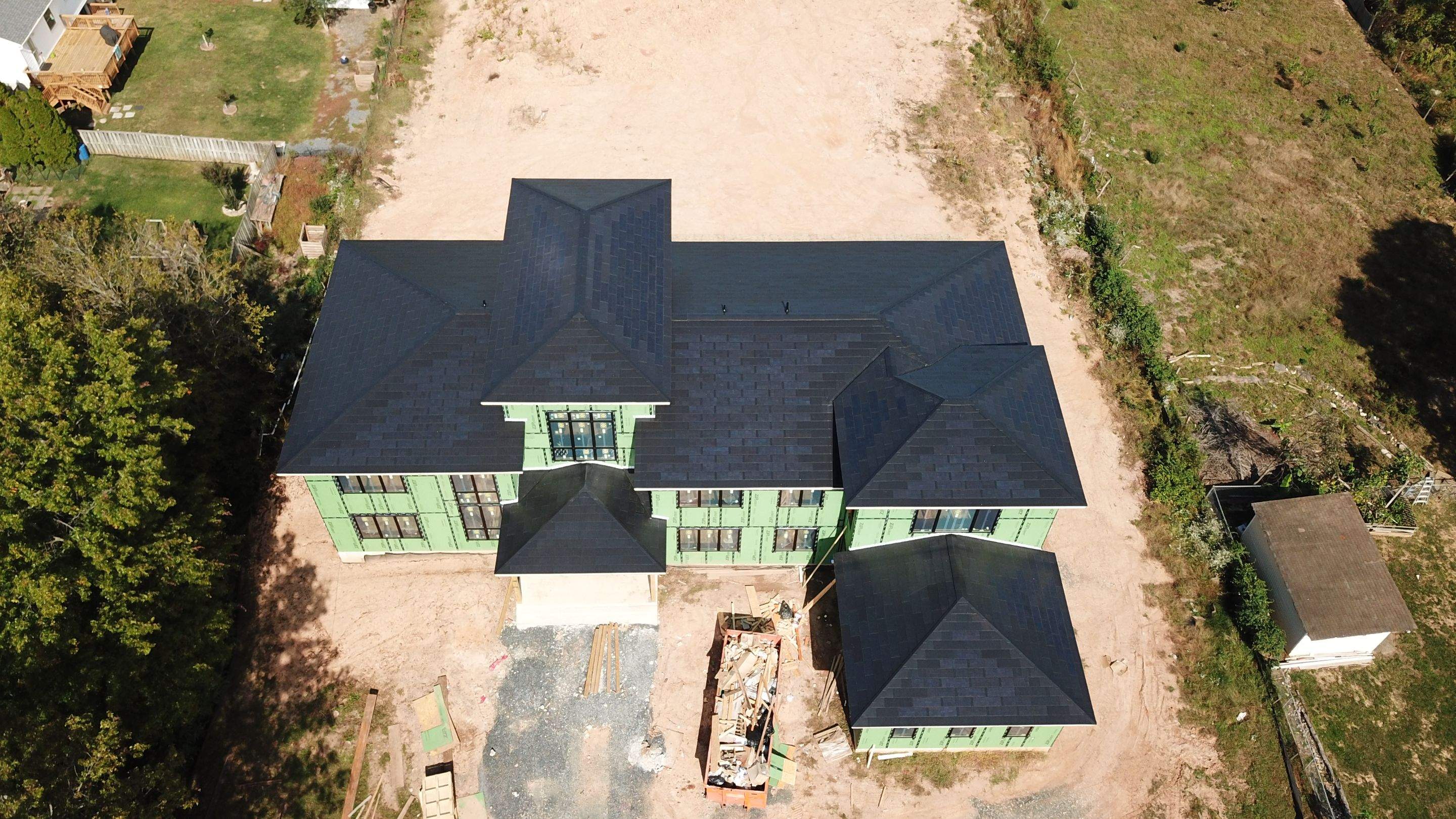 Tesla Solar Roof  using Tesla Solar Roof V3 tiles by American Home Contractors