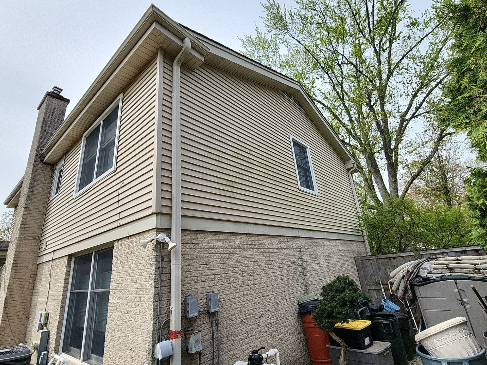 roof washing using Algaecide, soft wash soap by Northern Power Washing LLC.