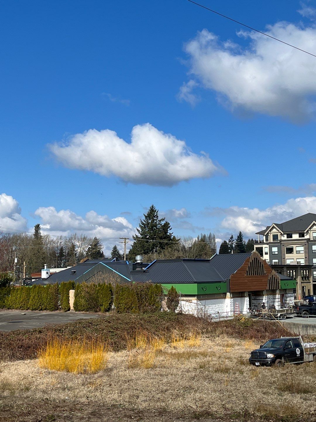 Commercial Roofing Installation using 12" Prolok metal and hidden gutters! by Top Notch Roofing Inc